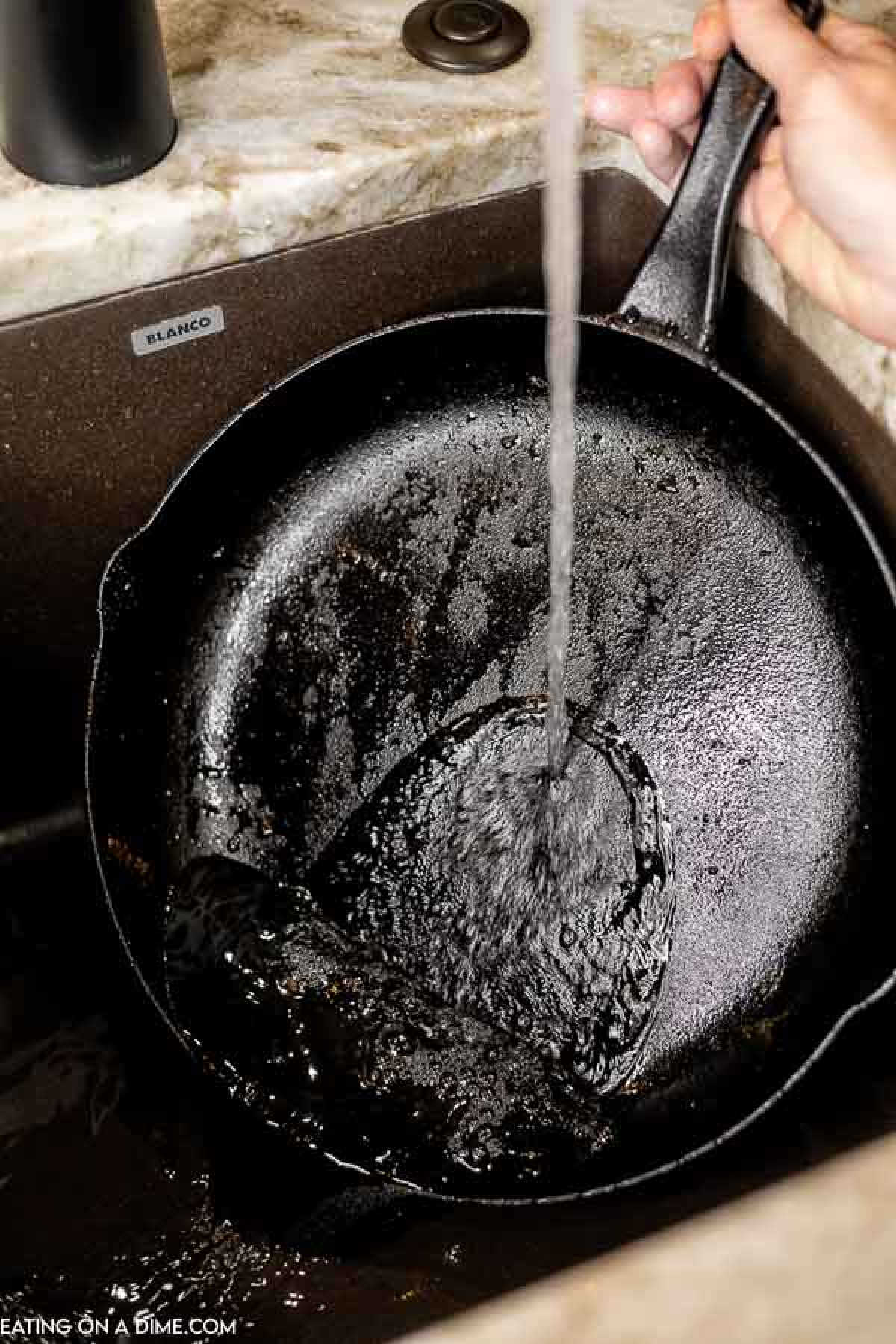 Rinsing the cast iron skillet with water