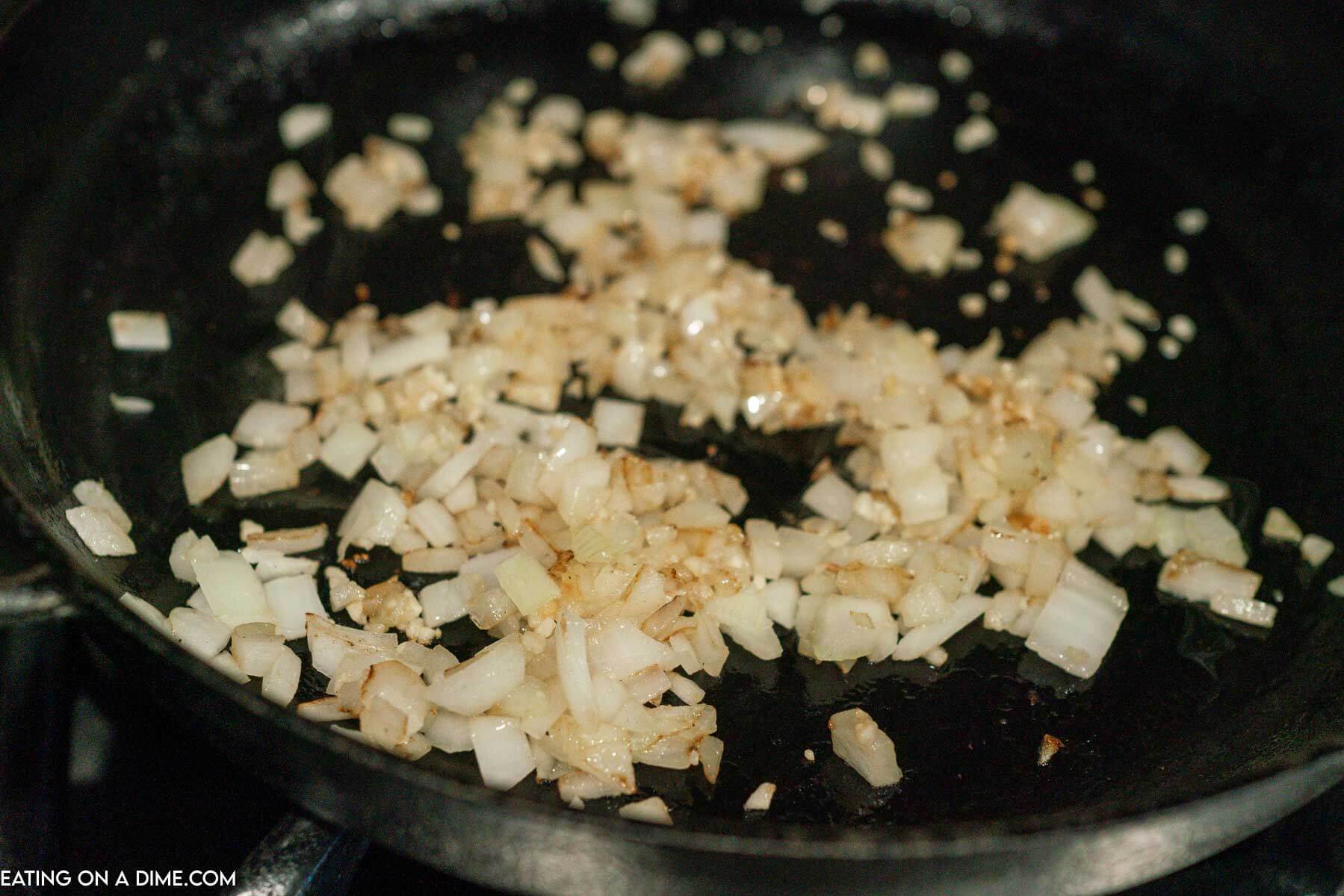 Cooking the garlic and onions in a iron skillet