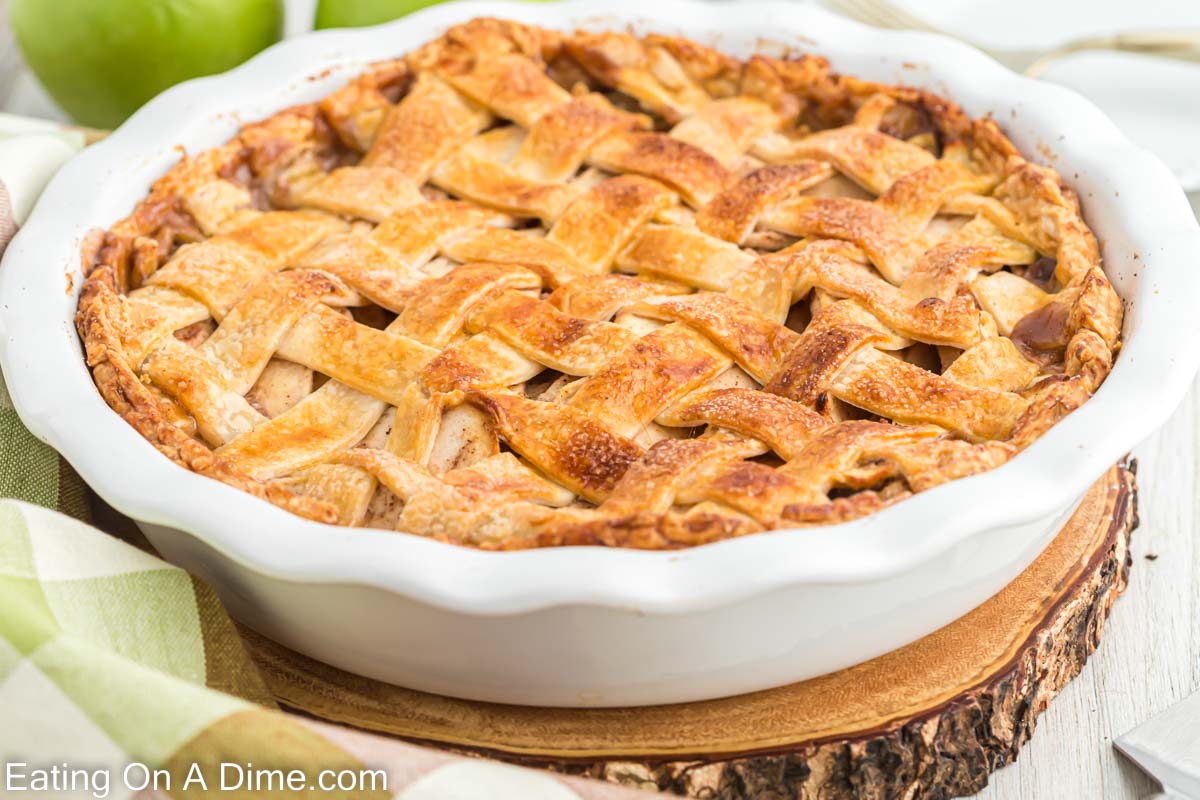 A whole salted caramel apple pie in a pie pan