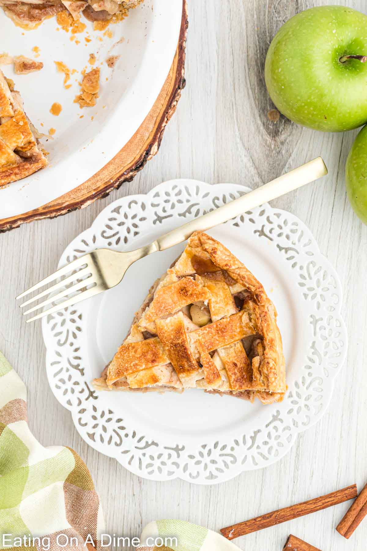 A slice of salted caramel apple pie on a white plate