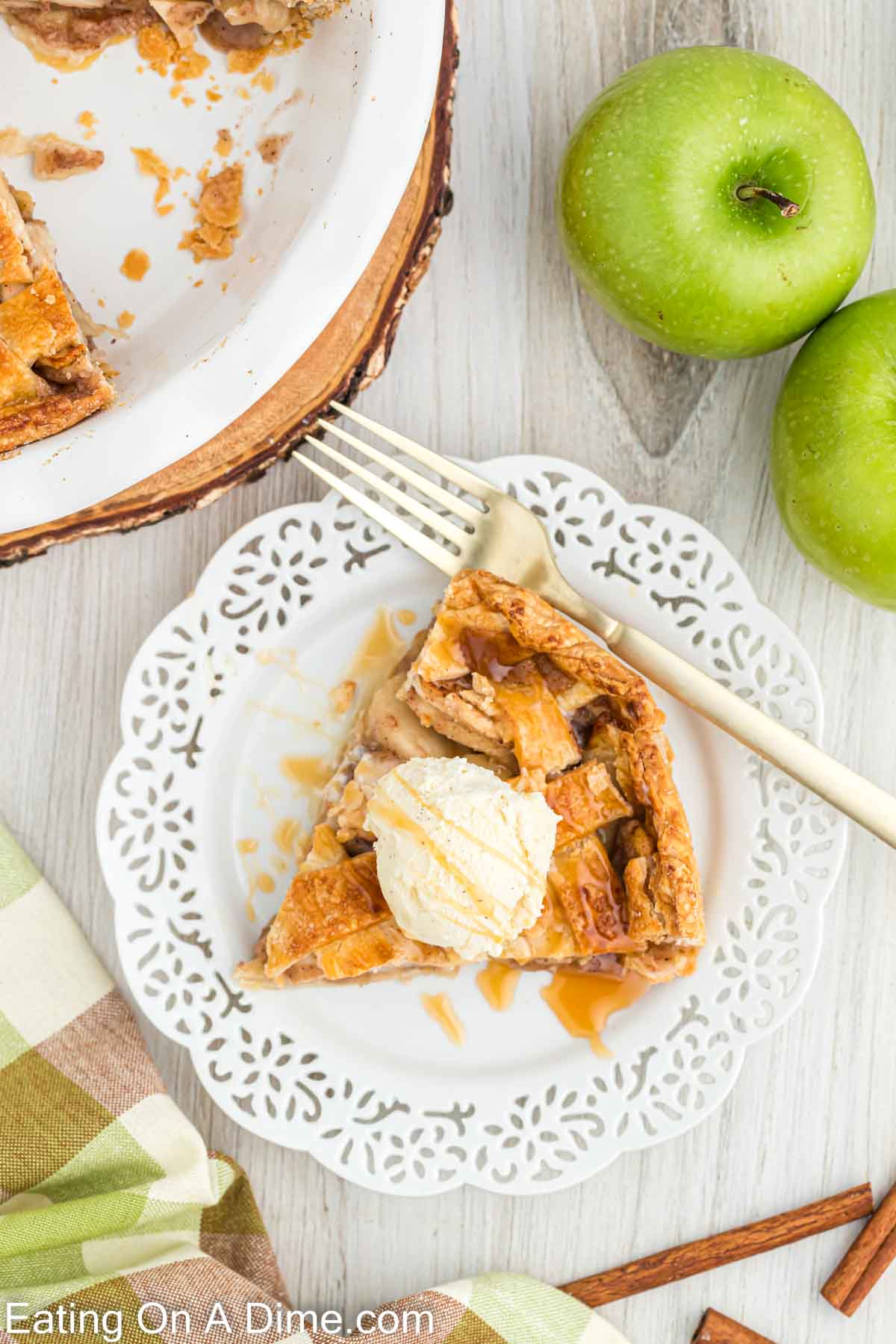 Salted caramel apple pie slice on a white plate