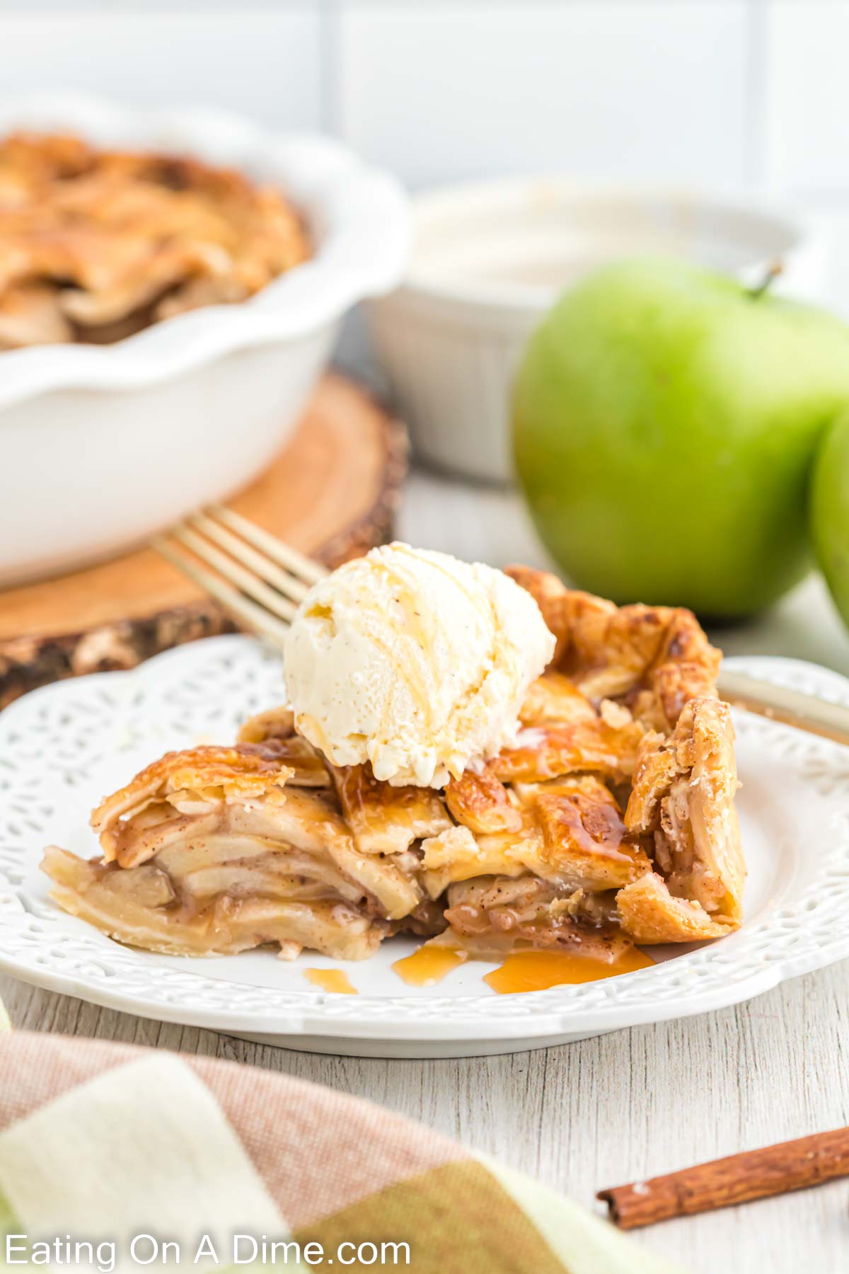 a slice of salted caramel apple pie on a white plate
