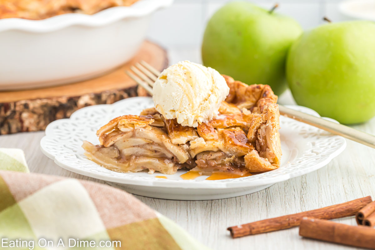 a slice of salted caramel apple pie on a white plate