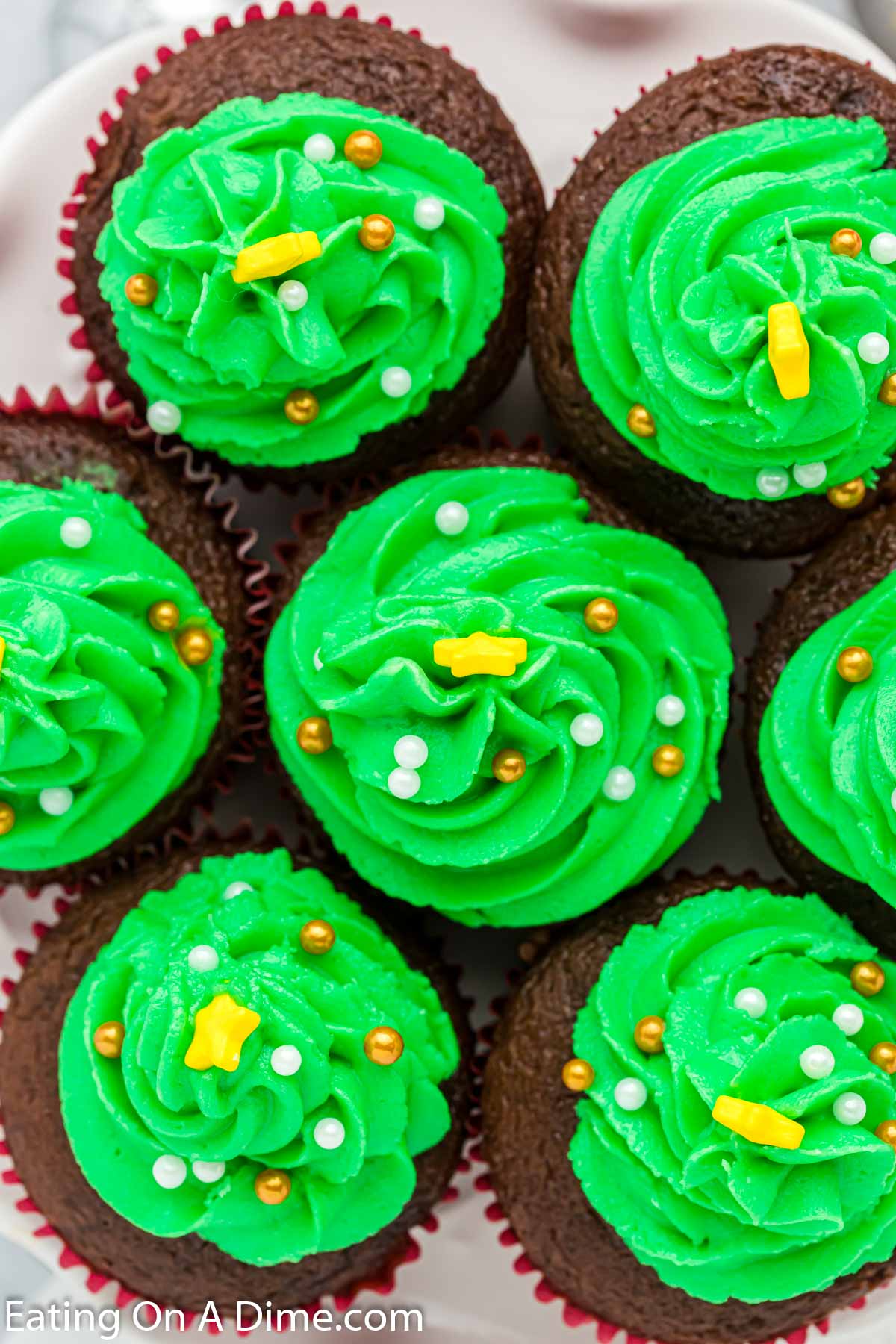 Overview of Christmas Tree Cupcakes topped with sprinkles