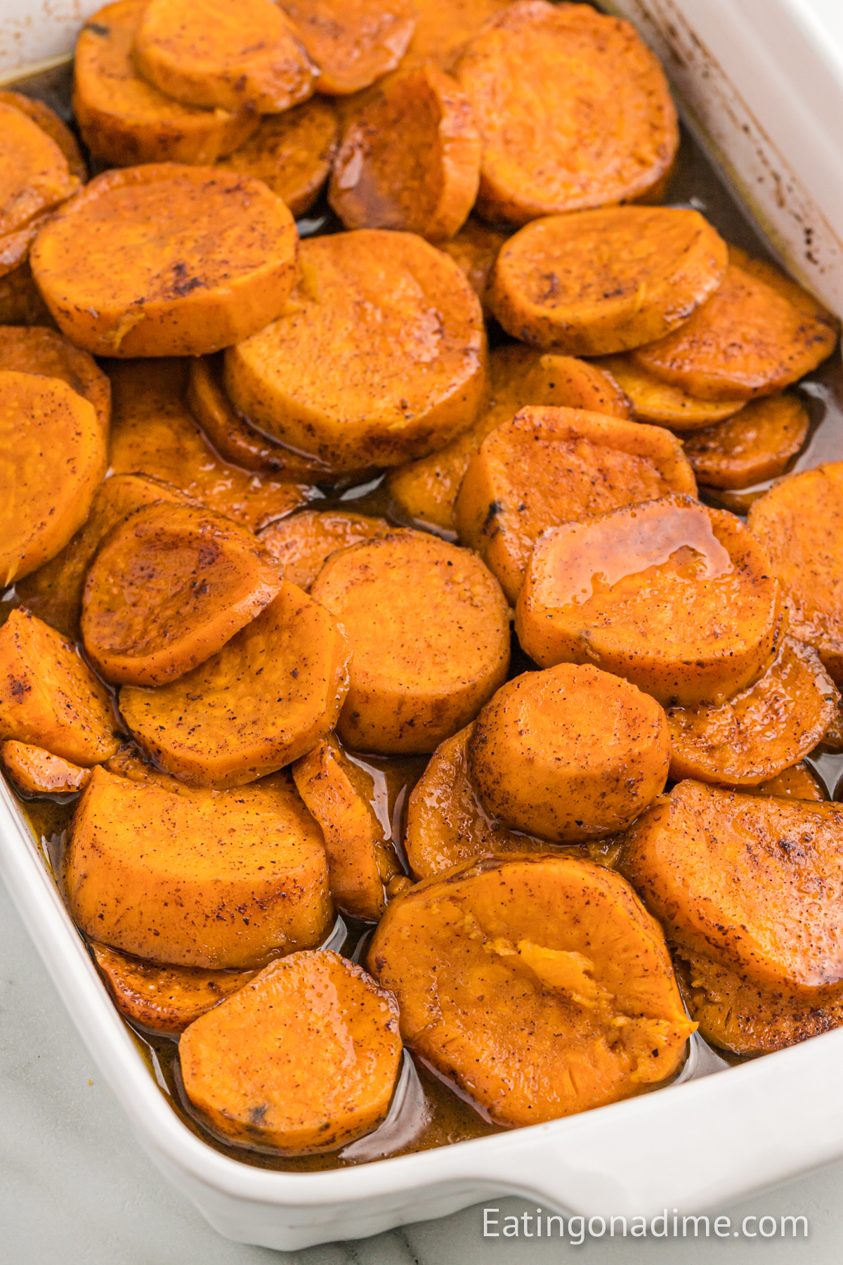 Candied sweet potatoes in a baking dish 