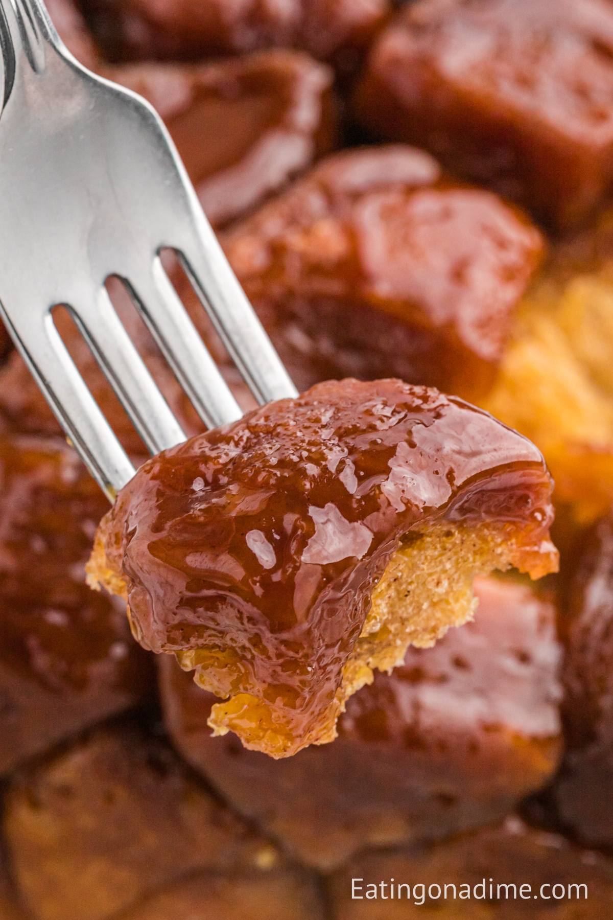 A bite of monkey bread on a fork