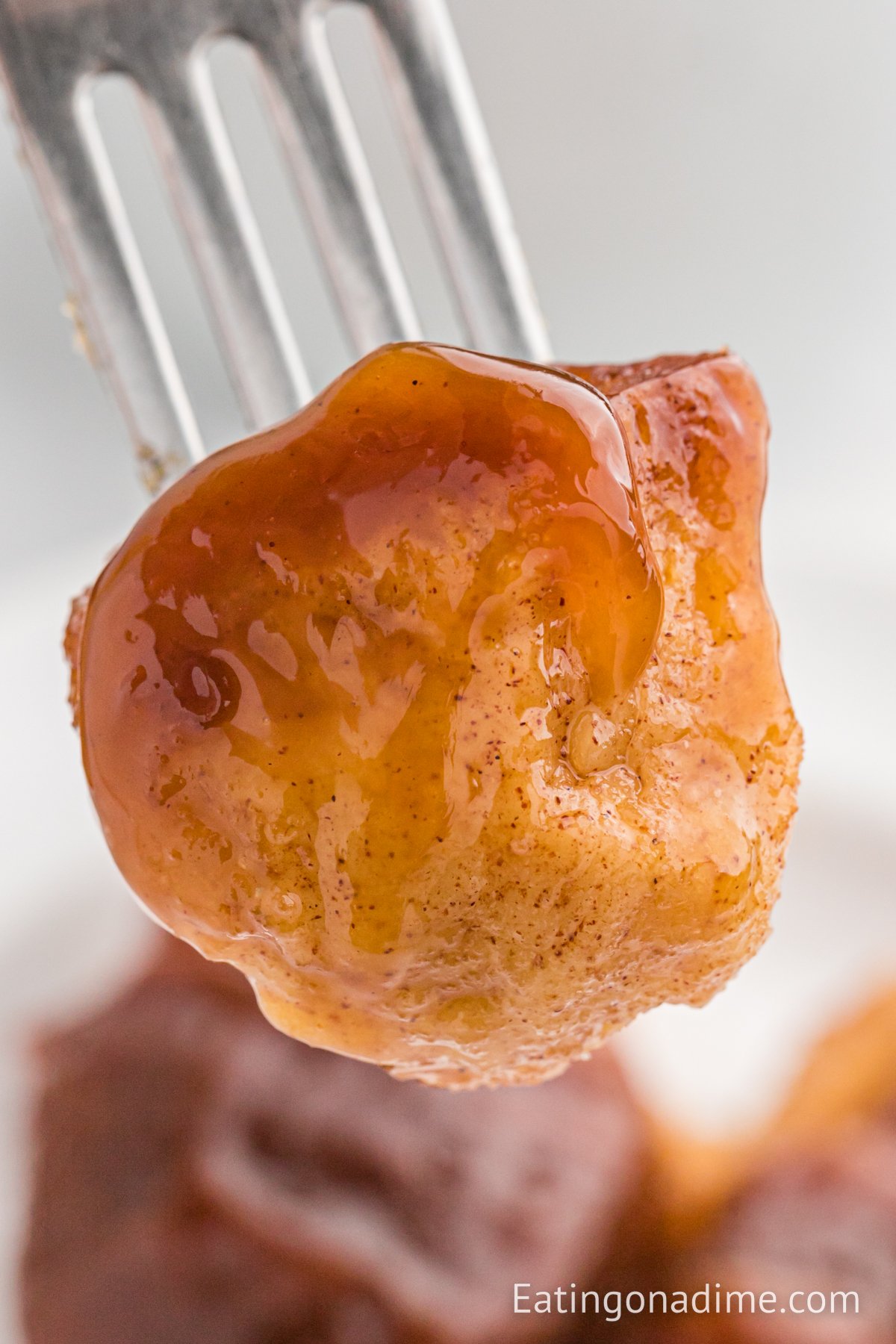 A bite of monkey bread on a fork