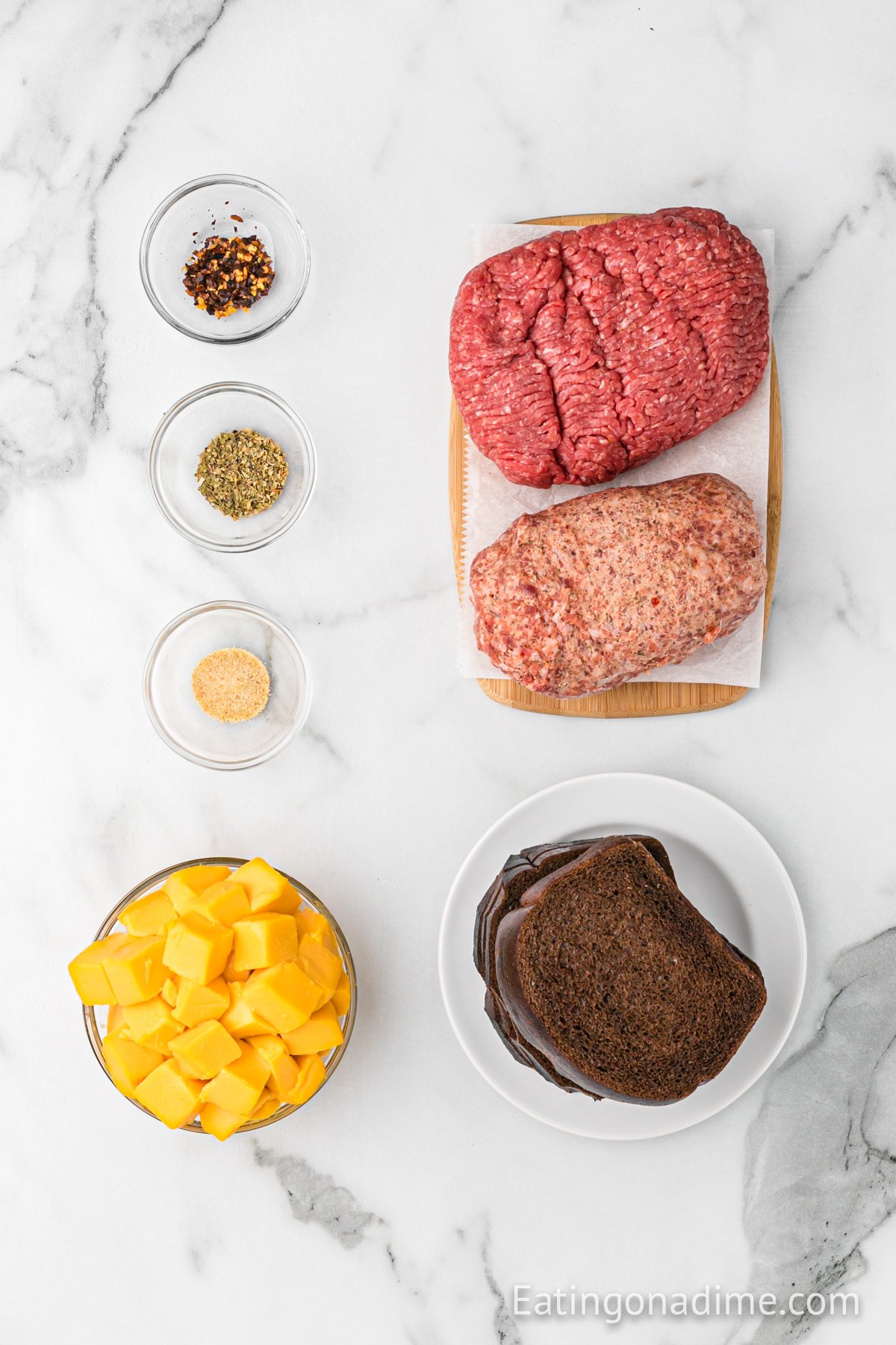 Ingredients needed - ground beef, hot pork sausage, velveeta cheese, garlic salt, oregano, red pepper flakes, rye bread