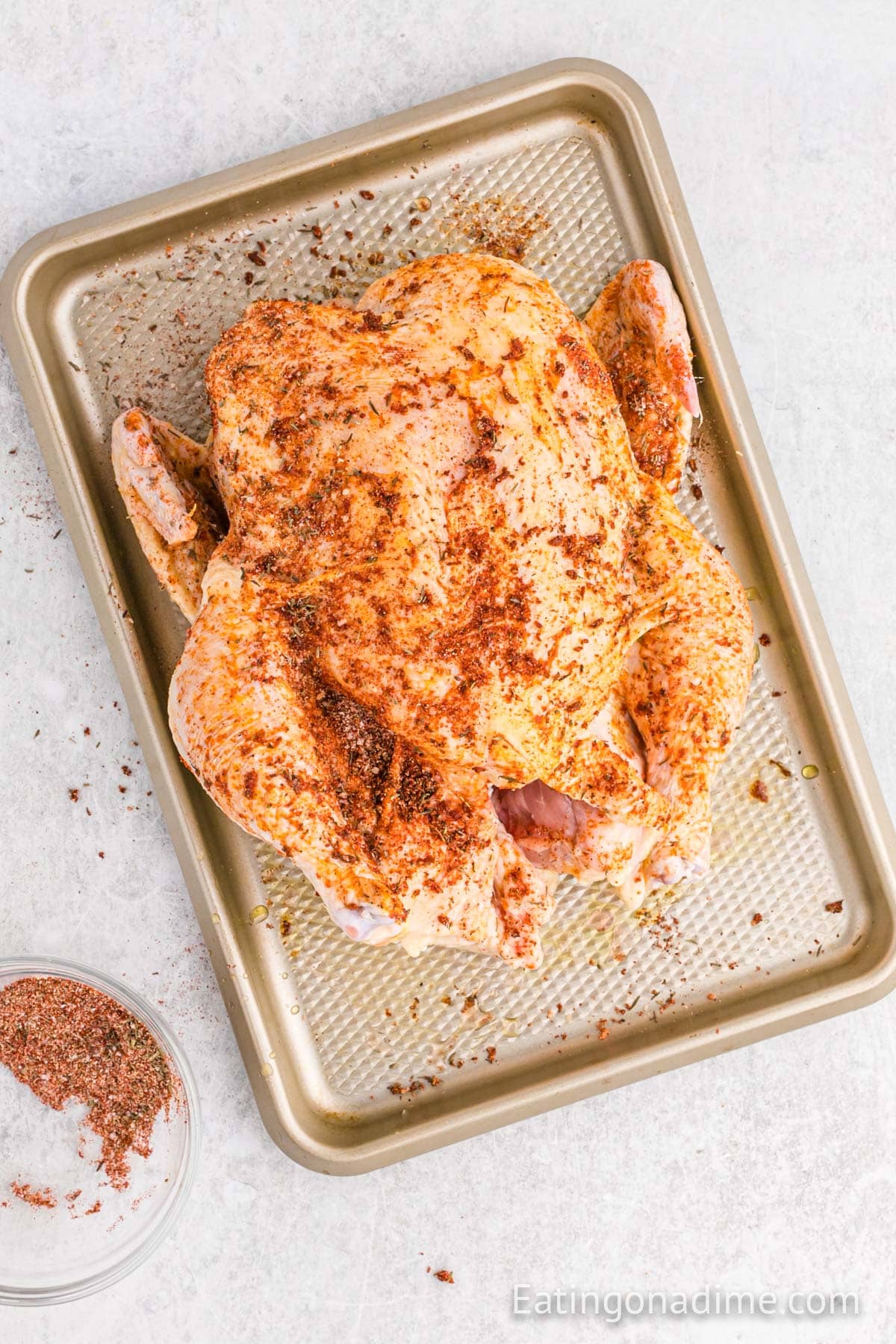 Whole Seasoned Chicken on a baking sheet