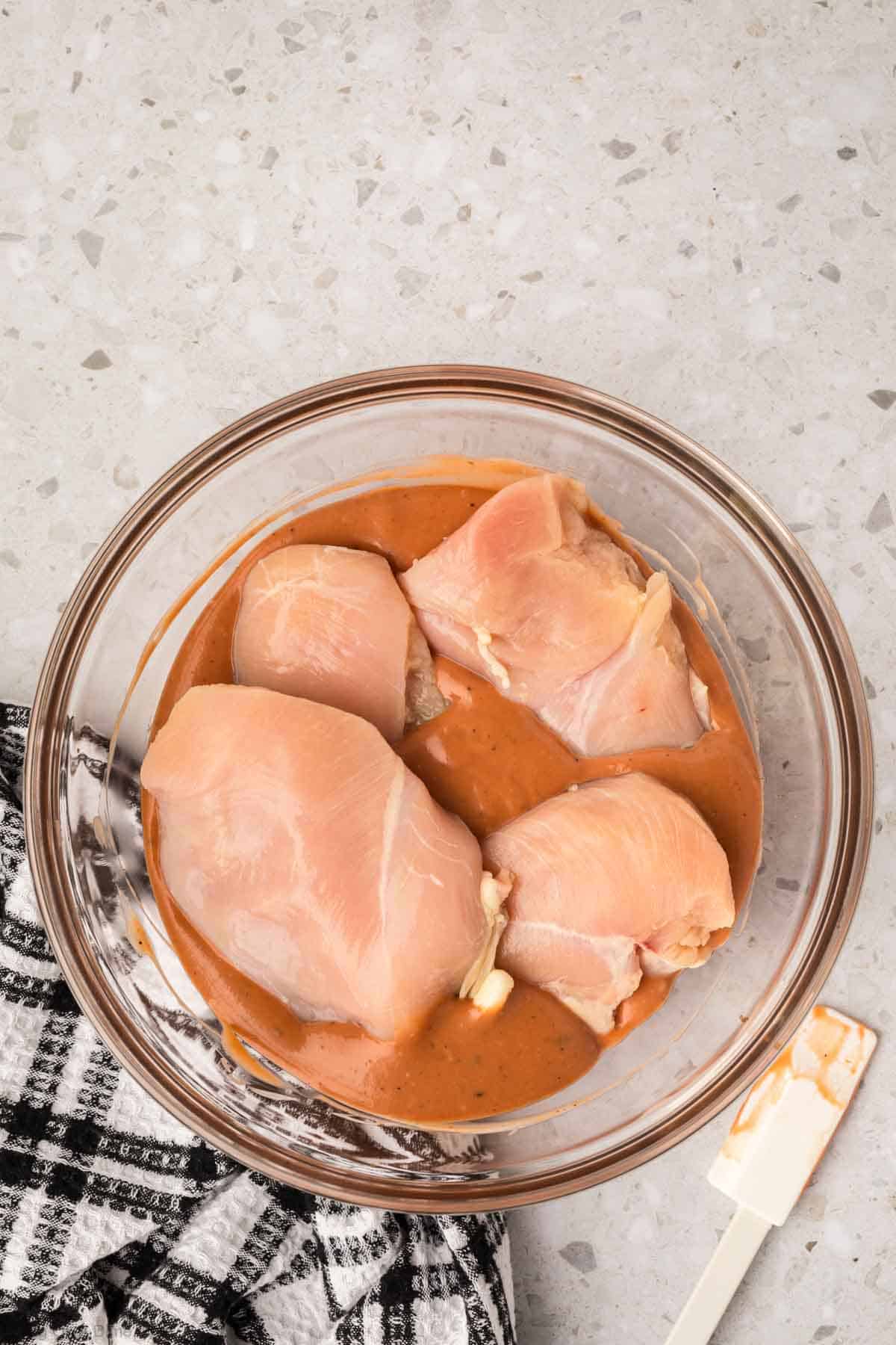 Marinating chicken in the BBQ Sauce and Ranch Dressing mixture in a bowl