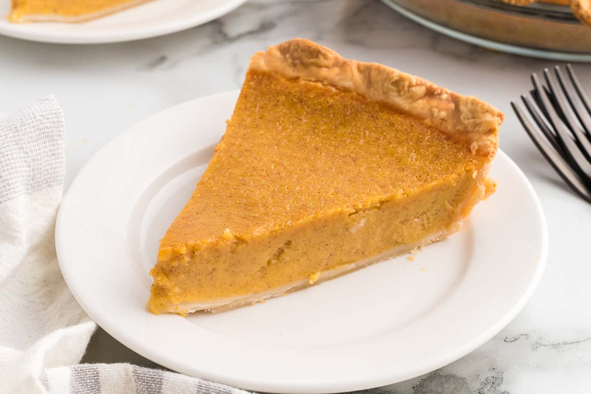 A slice of butternut squash pie on a plate