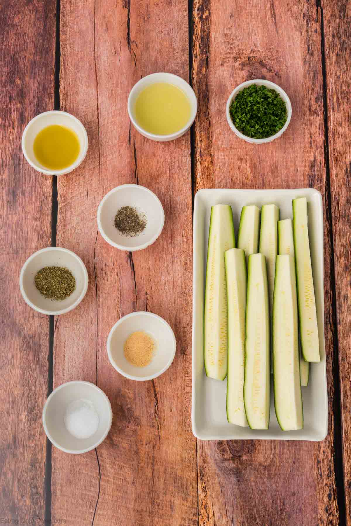 Grilled zucchini ingredients - fresh zucchini, olive oil, lemon, Italian seasoning, garlic powder, salt, pepper, fresh parsley