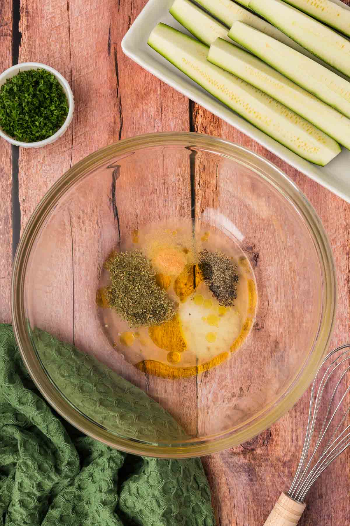 Combining the seasoning with olive oil in a bowl