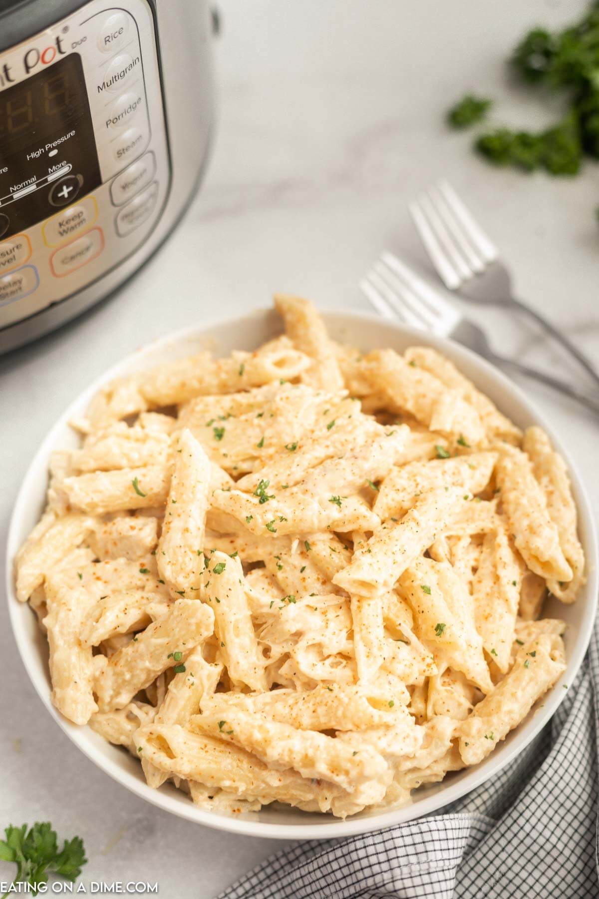 Creamy Cajun Chicken Pasta in a white bowl