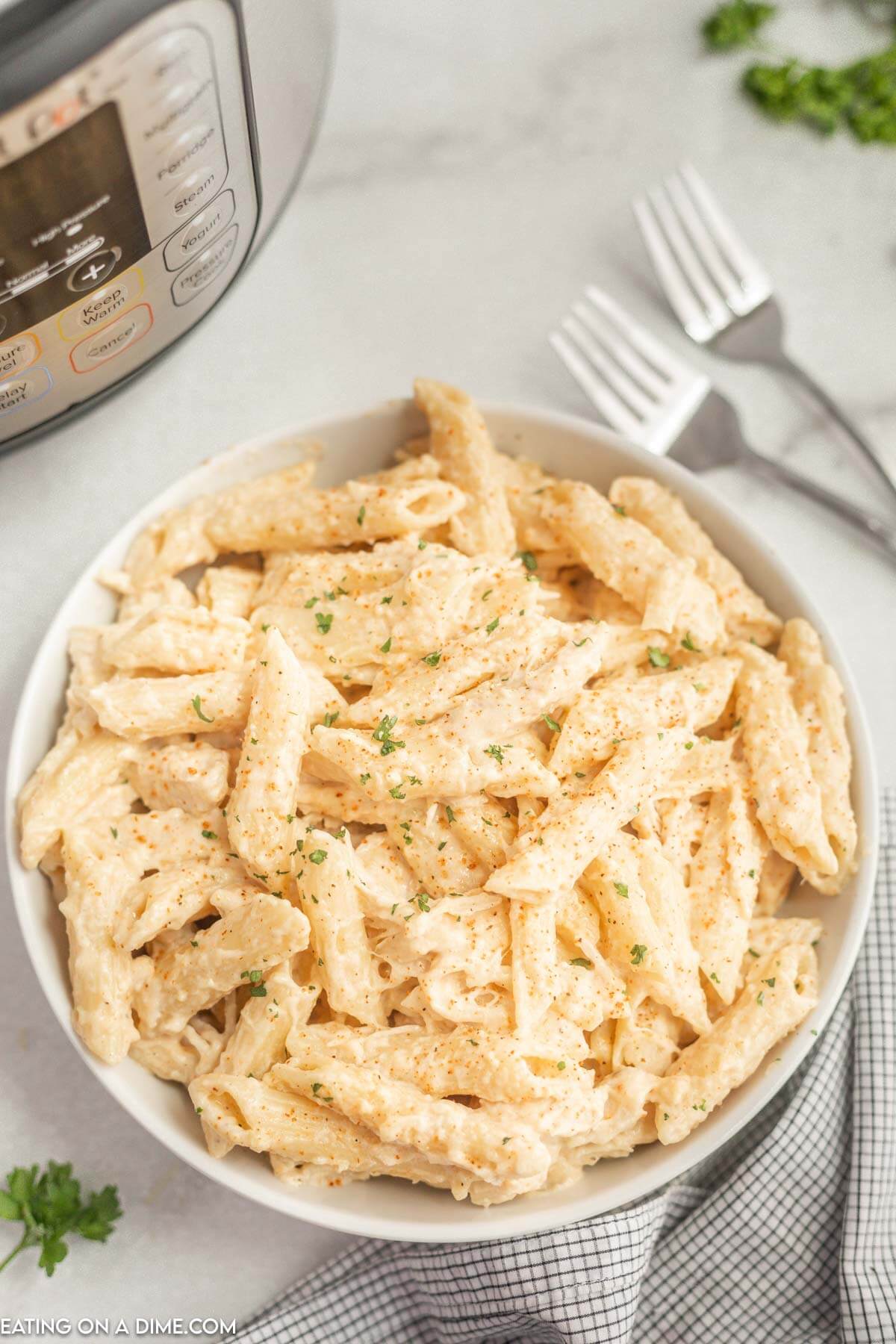 Creamy Cajun Chicken Pasta in a white bowl