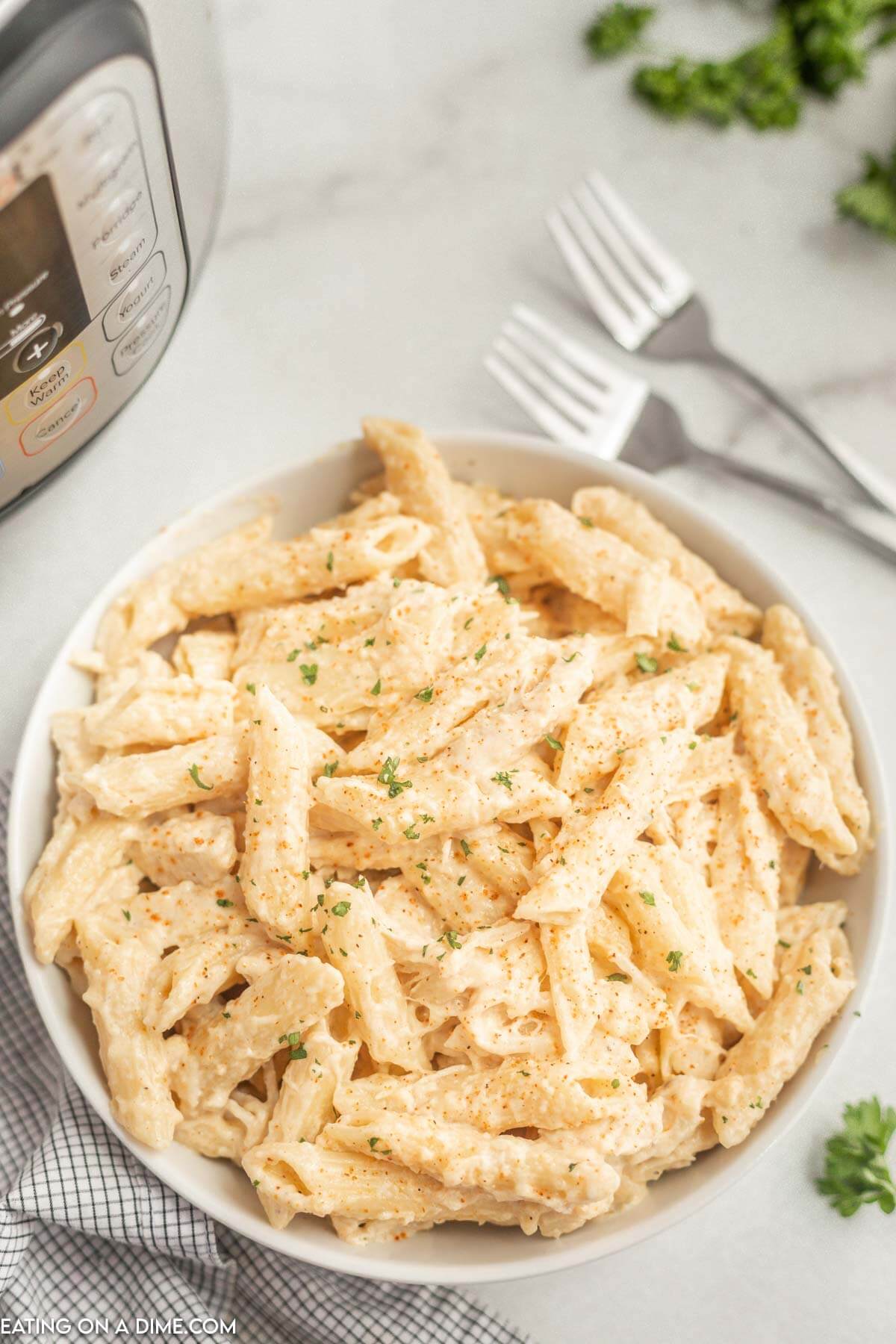 Creamy Cajun Chicken Pasta in a white bowl