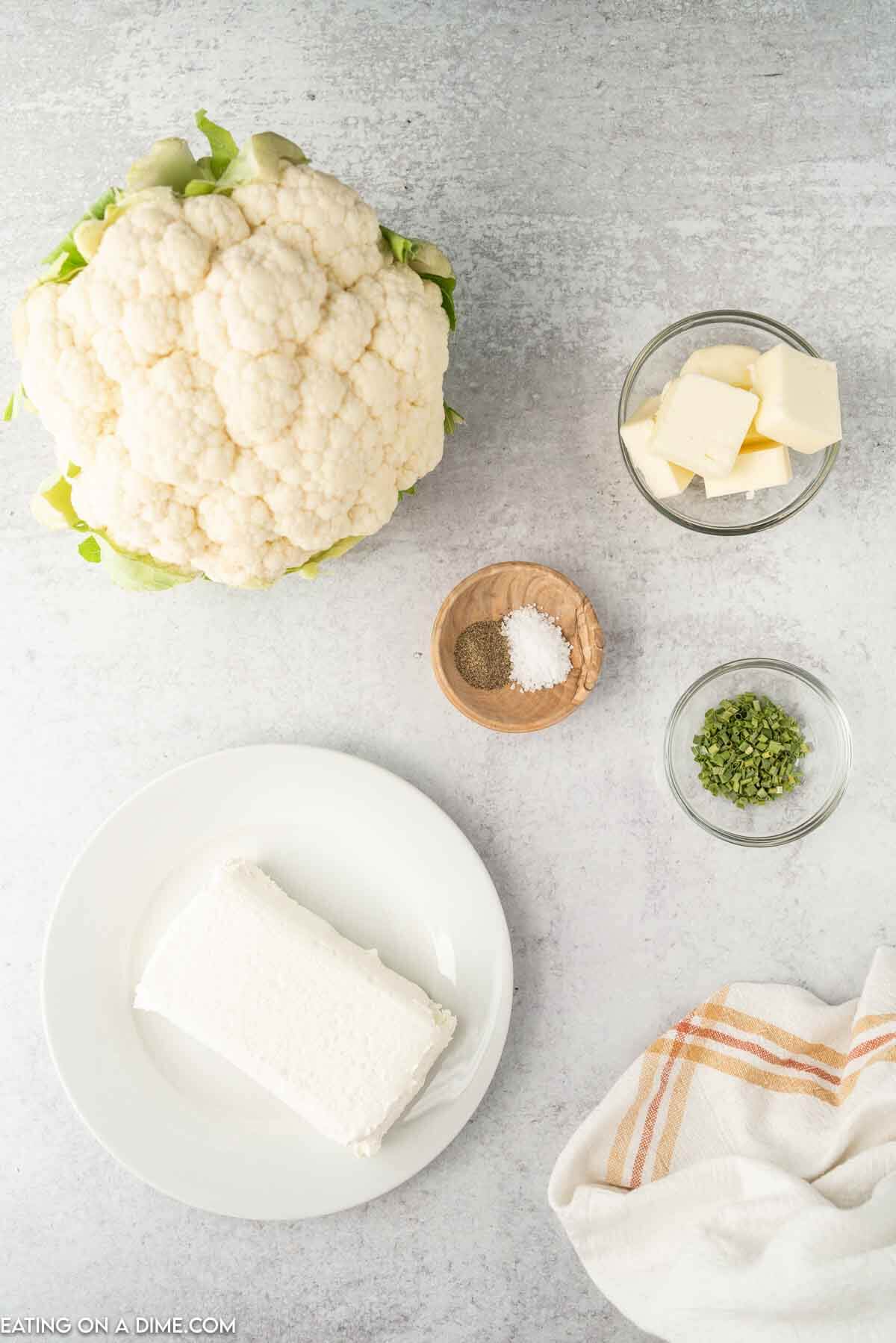 ingredients needed - fresh cauliflower, cream cheese, butter, salt and pepper, chives