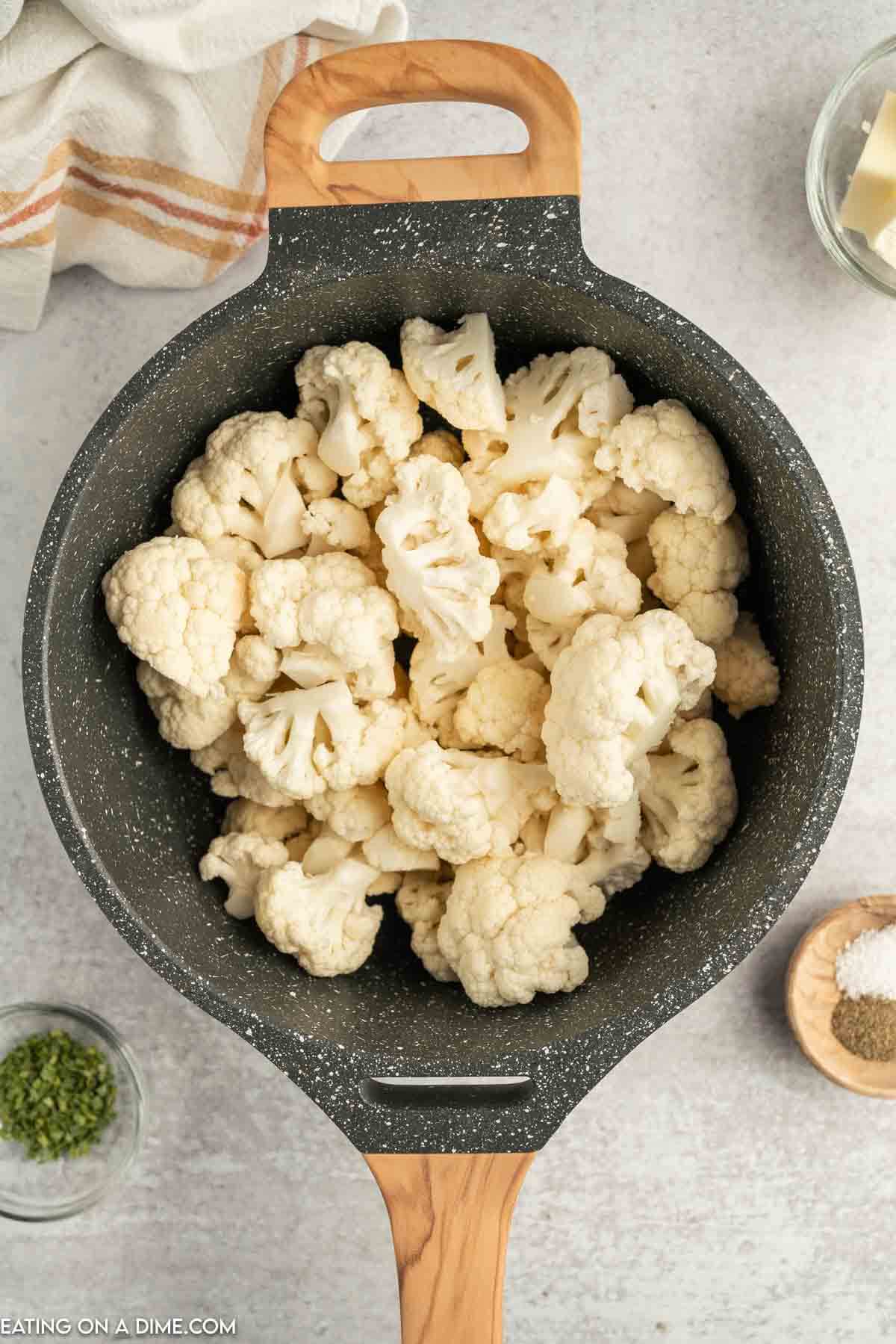 chopped cauliflower in a sauce pan