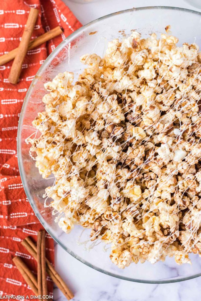 Cinnamon Roll Popcorn in a clear bowl 