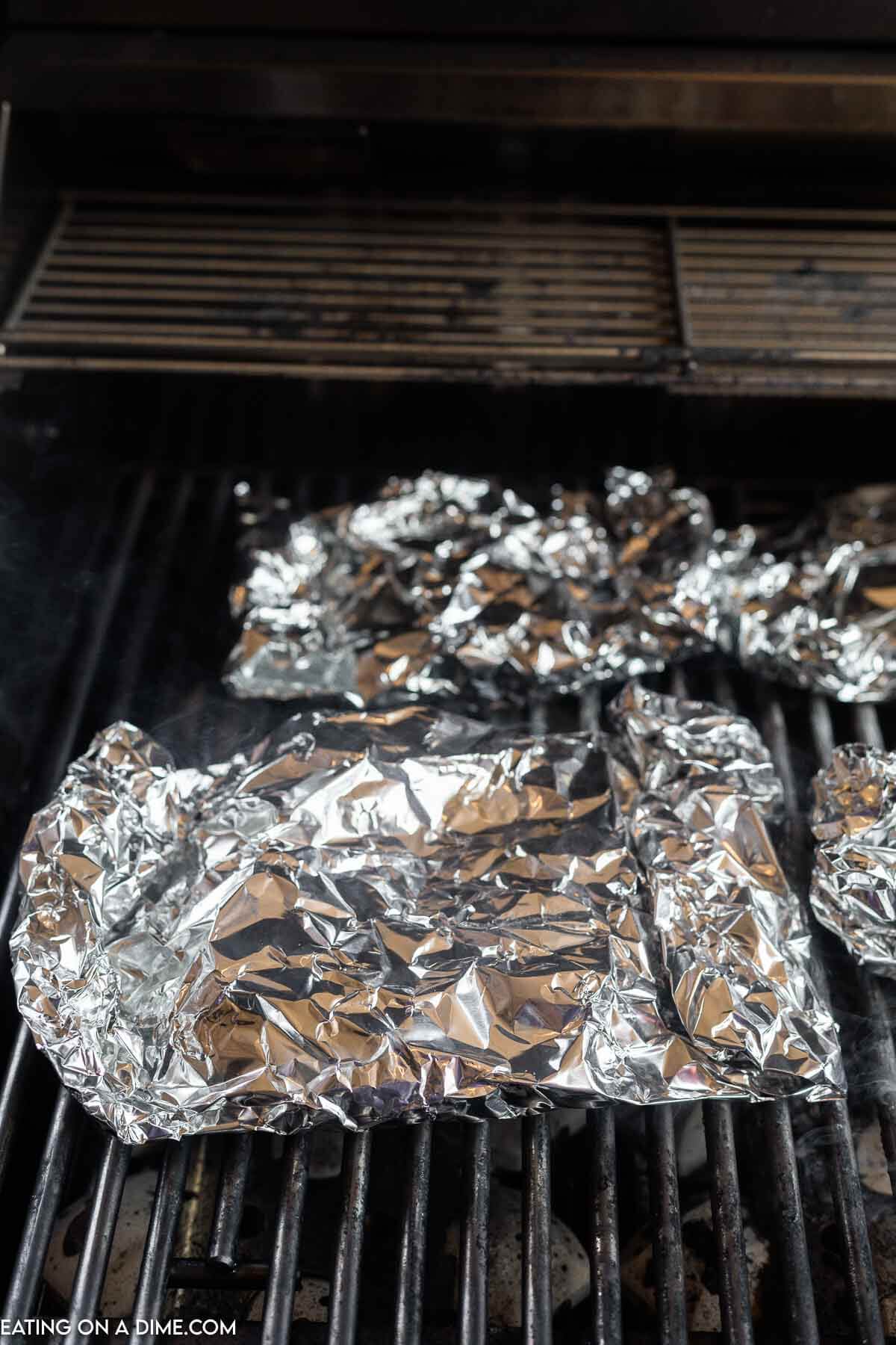 Placed crack chicken foil packs on the grill grates