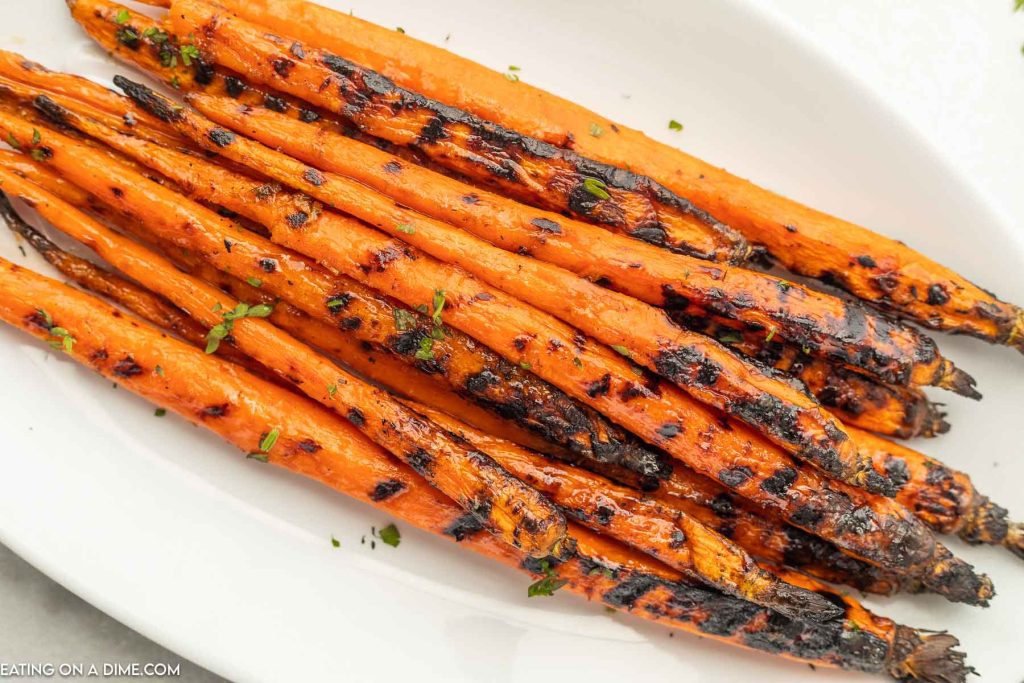 Grilled carrots on a plate. 