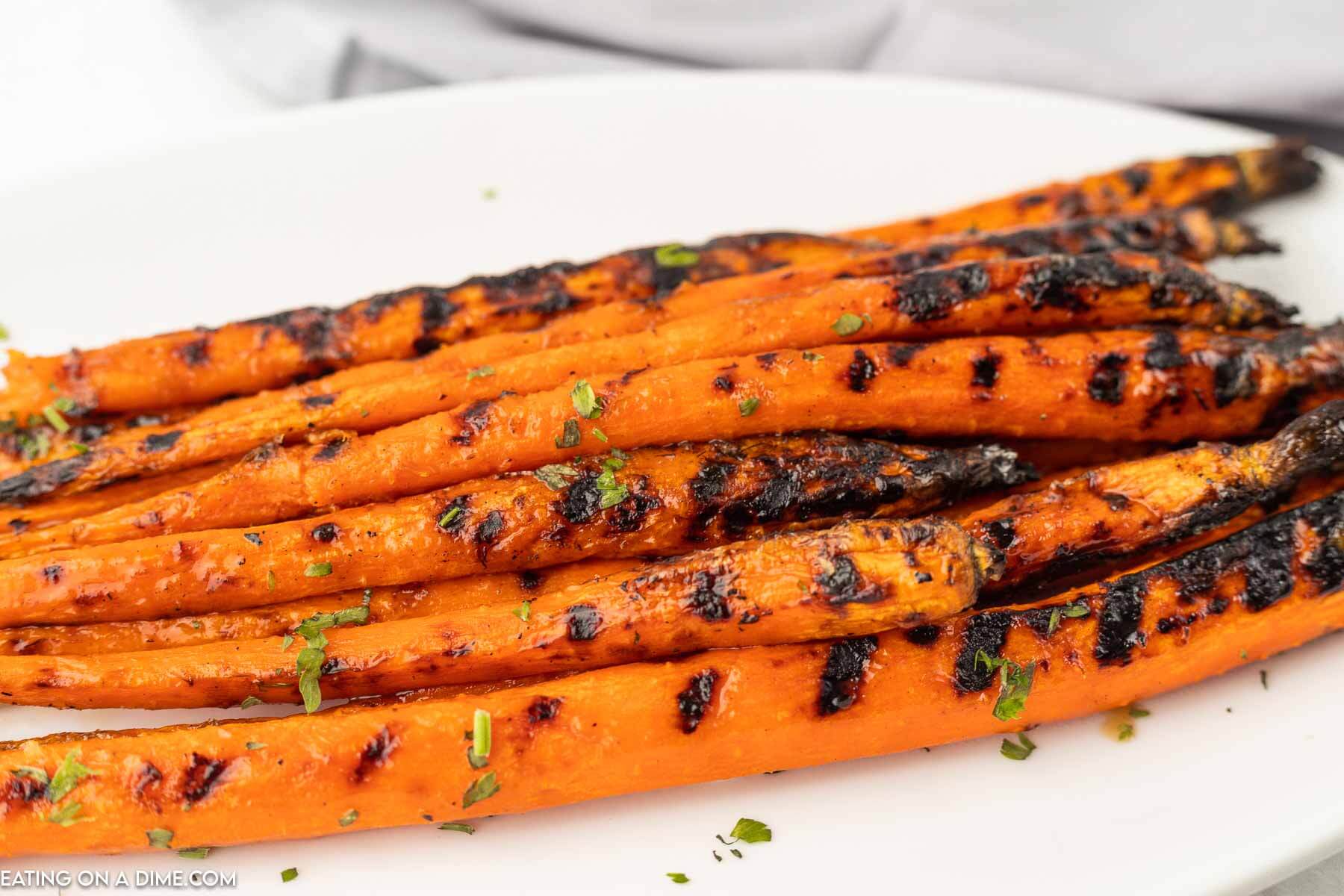 Grilled carrots on a plate. 