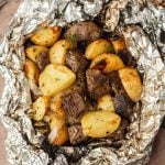 Chunks of roasted potatoes and beef, seasoned with herbs, come together in this classic Steak and Potato Foil Pack for a hearty, flavor-packed meal.