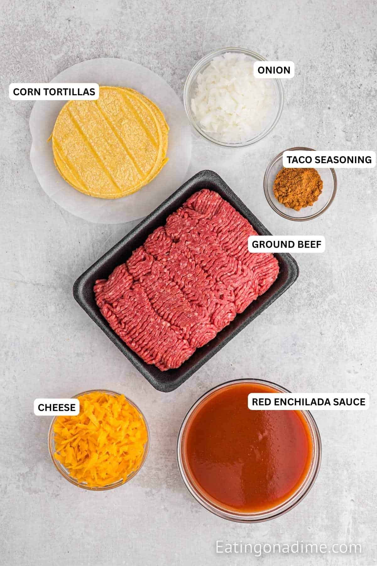 Ingredients for recipe: corn tortillas, onion, taco seasoning, ground beef, cheees and red enchilada sauce.