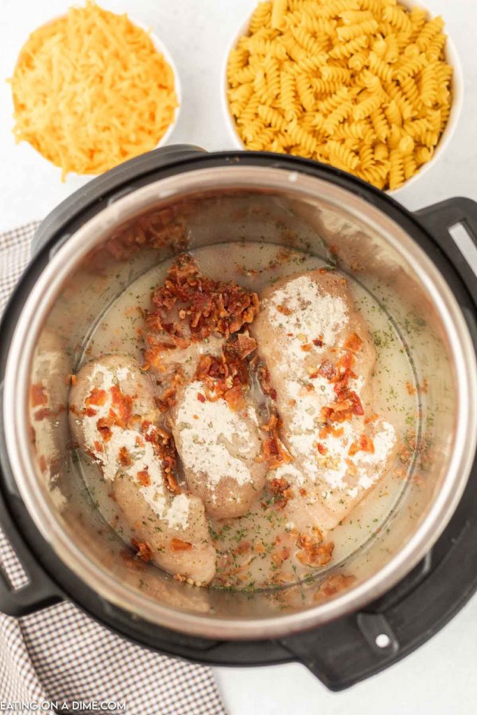 Uncooked ingredients of bacon chicken ranch in the instant pot