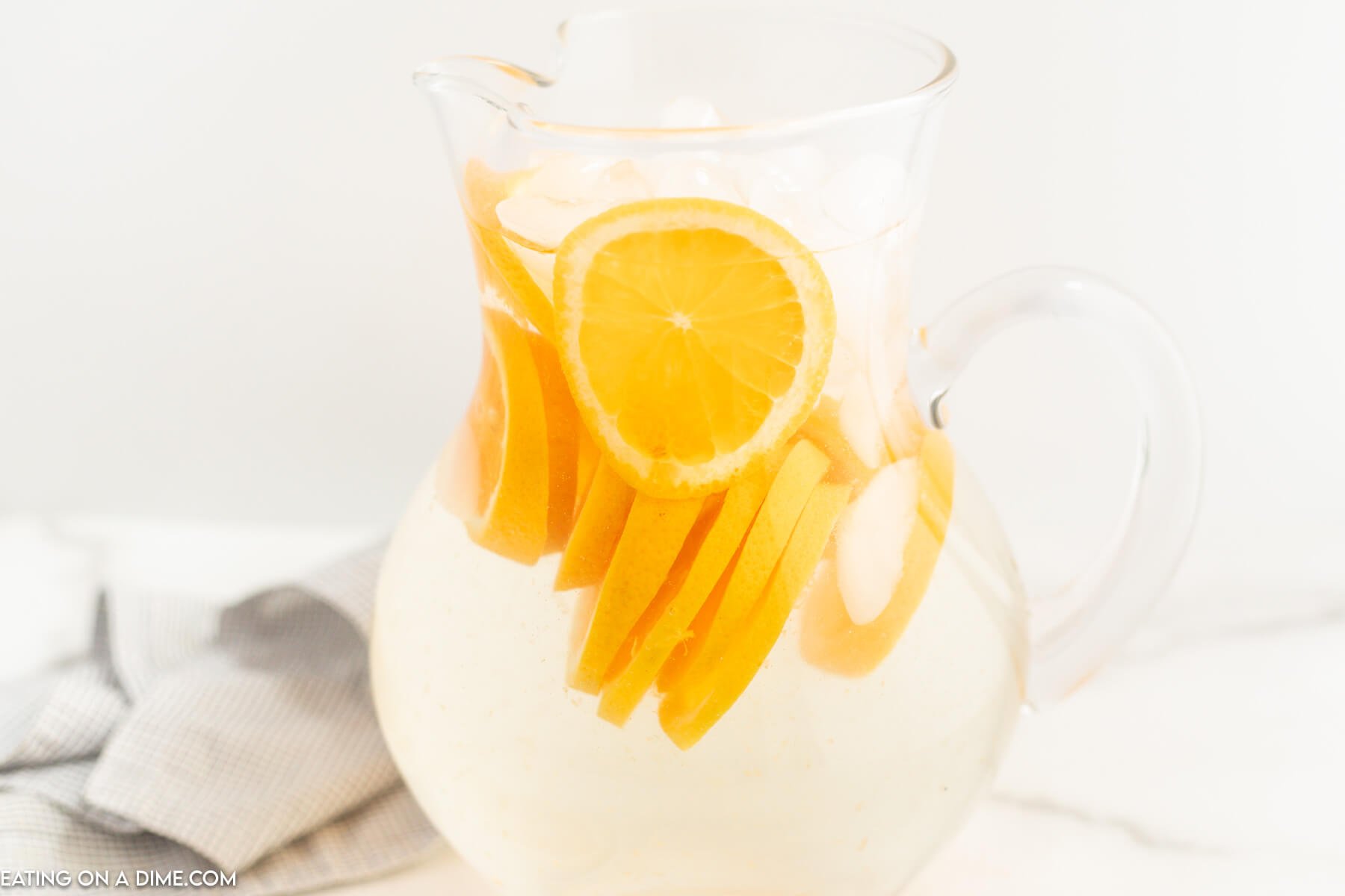 A pitcher of orange water