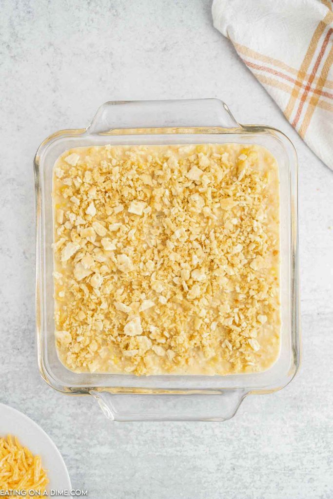 Scalloped corn recipe topped with cracker topping. 
