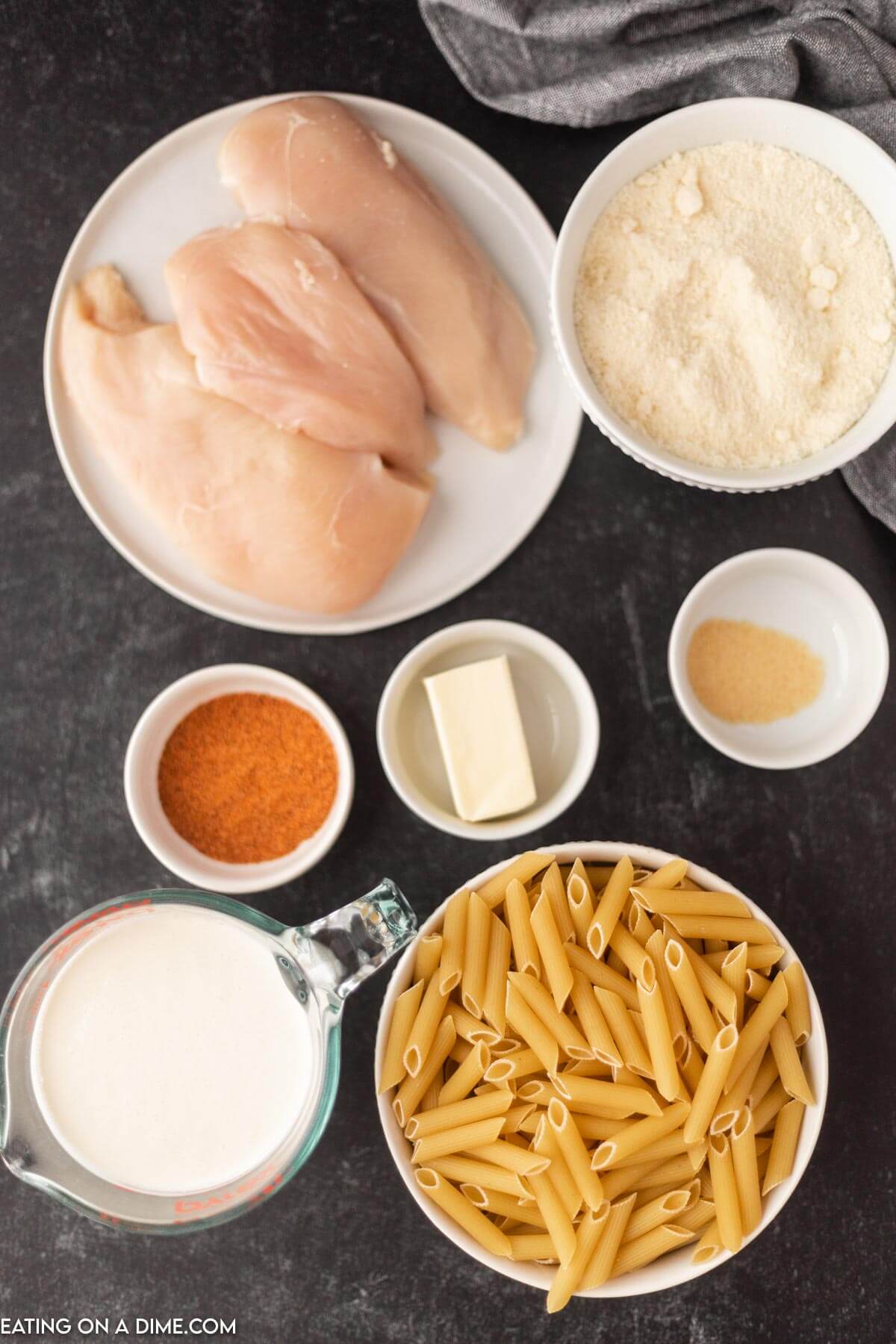 Ingredients needed - chicken breast, heavy whipping cream, chicken broth, butter, cajun seasoning, garlic powder, penne pasta, parmesan cheese