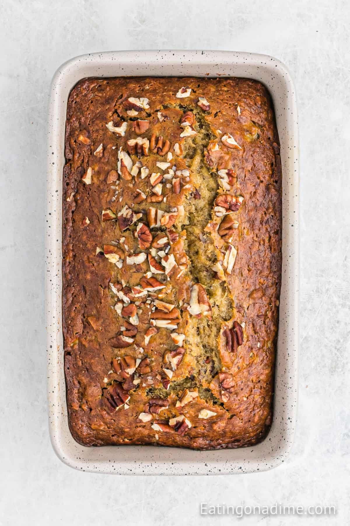 Baked banana bread in a loaf pan.
