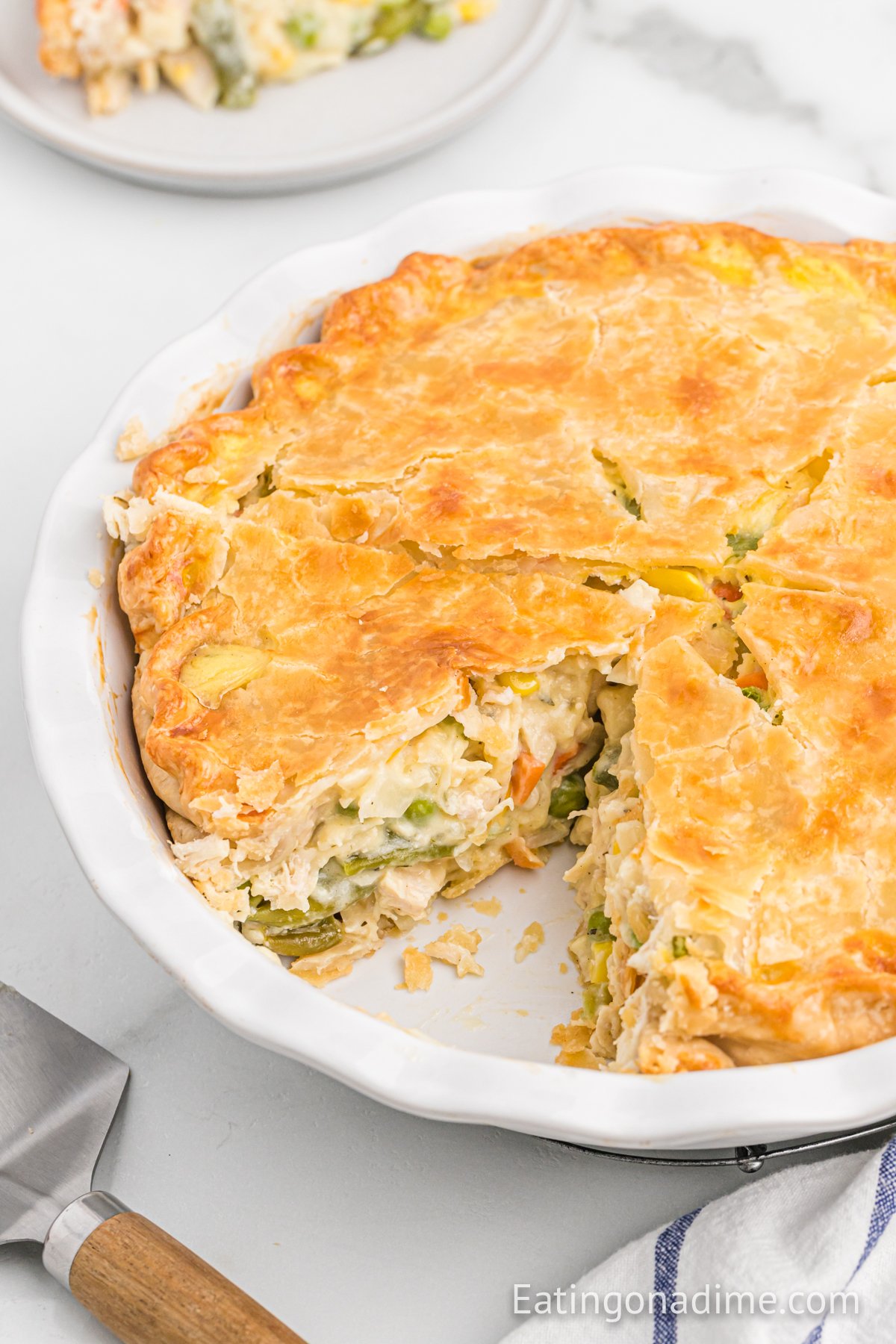 Turkey Pot Pie in a baking dish with a slice missing