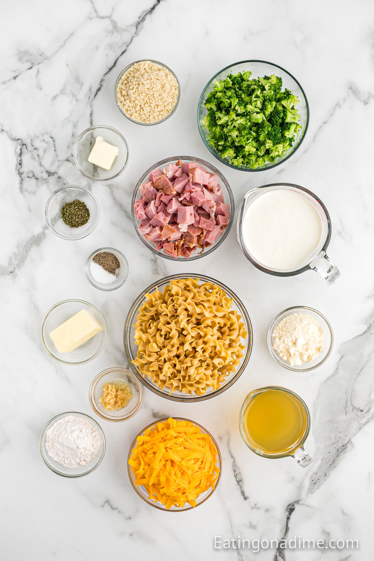 Ingredients needed - butter, minced garlic, italian seasoning, flour, salt and pepper, chicken broth, heavy cream, cheddar cheese, noodles, leftover ham, broccoli, bread crumbs, parmesan cheese