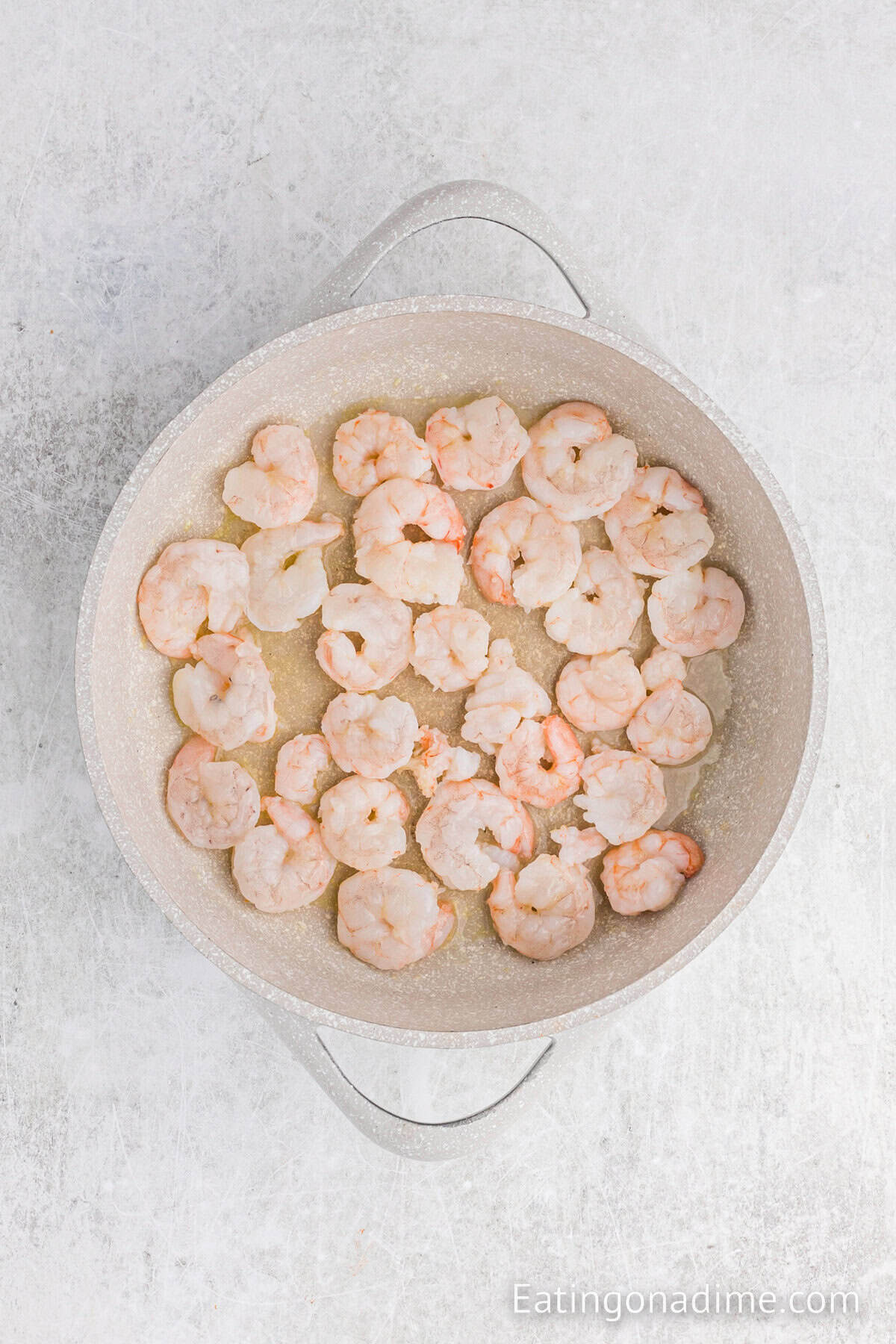 Shrimp in a large skillet.