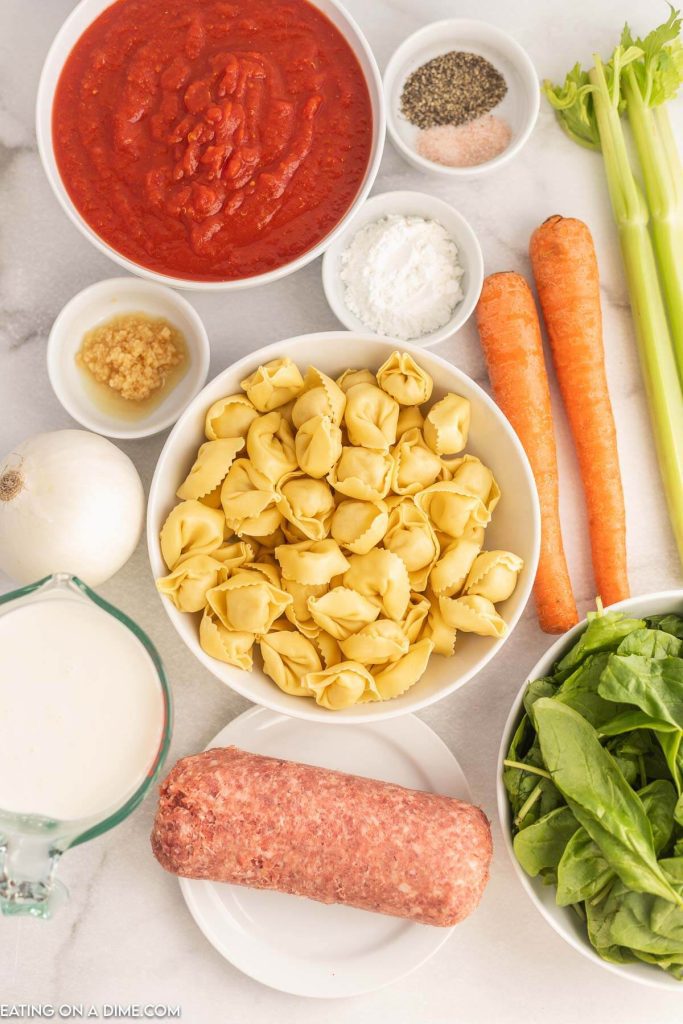 Ingredients needed - italian sausage, onion, carrots, celery, minced garlic, salt and pepper, italian seasoning, crushed tomatoes, chicken broth, cheese tortellini, spinach, heavy whipping cream, cornstarch
