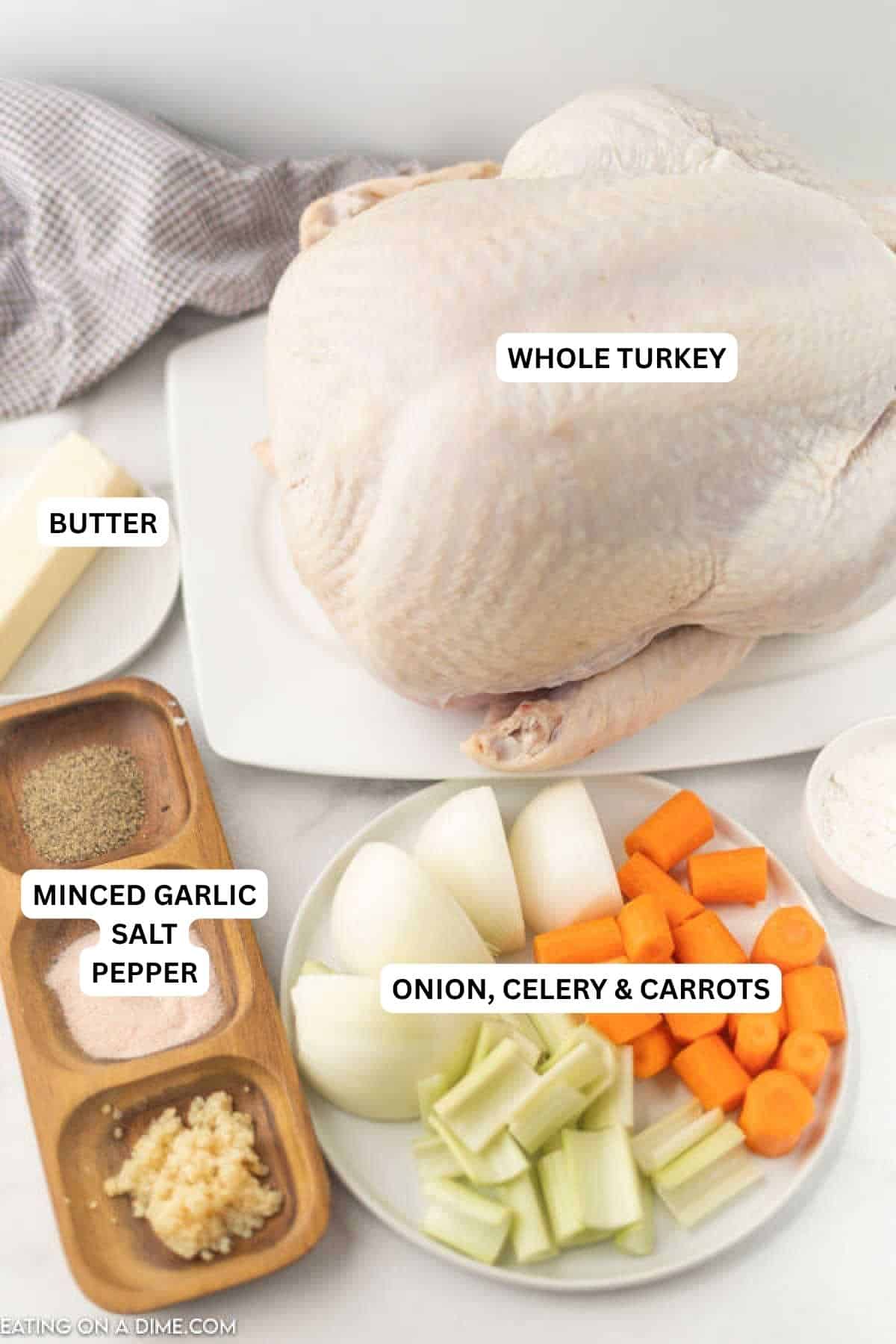 Ingredients for recipe: onion, celery, carrots, minced garlic, salt, pepper, butter and whole turkey.