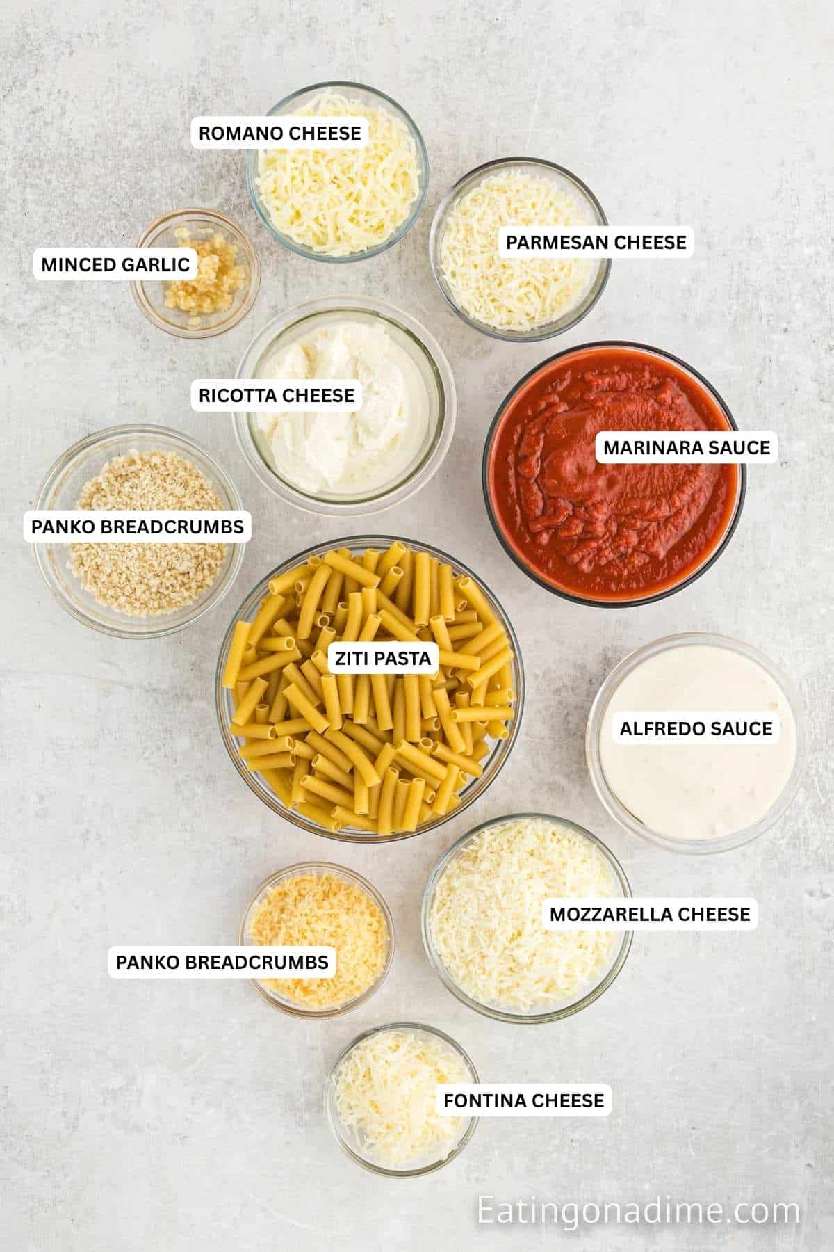 Ingredients for recipe: Romano cheese, parmesan cheese, minced garlic, ricotta cheese, marinara sauce, panko breadcrumbs, ziti pasta, Alfredo sauce, mozzarella sauce, panko breadcrumbs and fontina cheese.