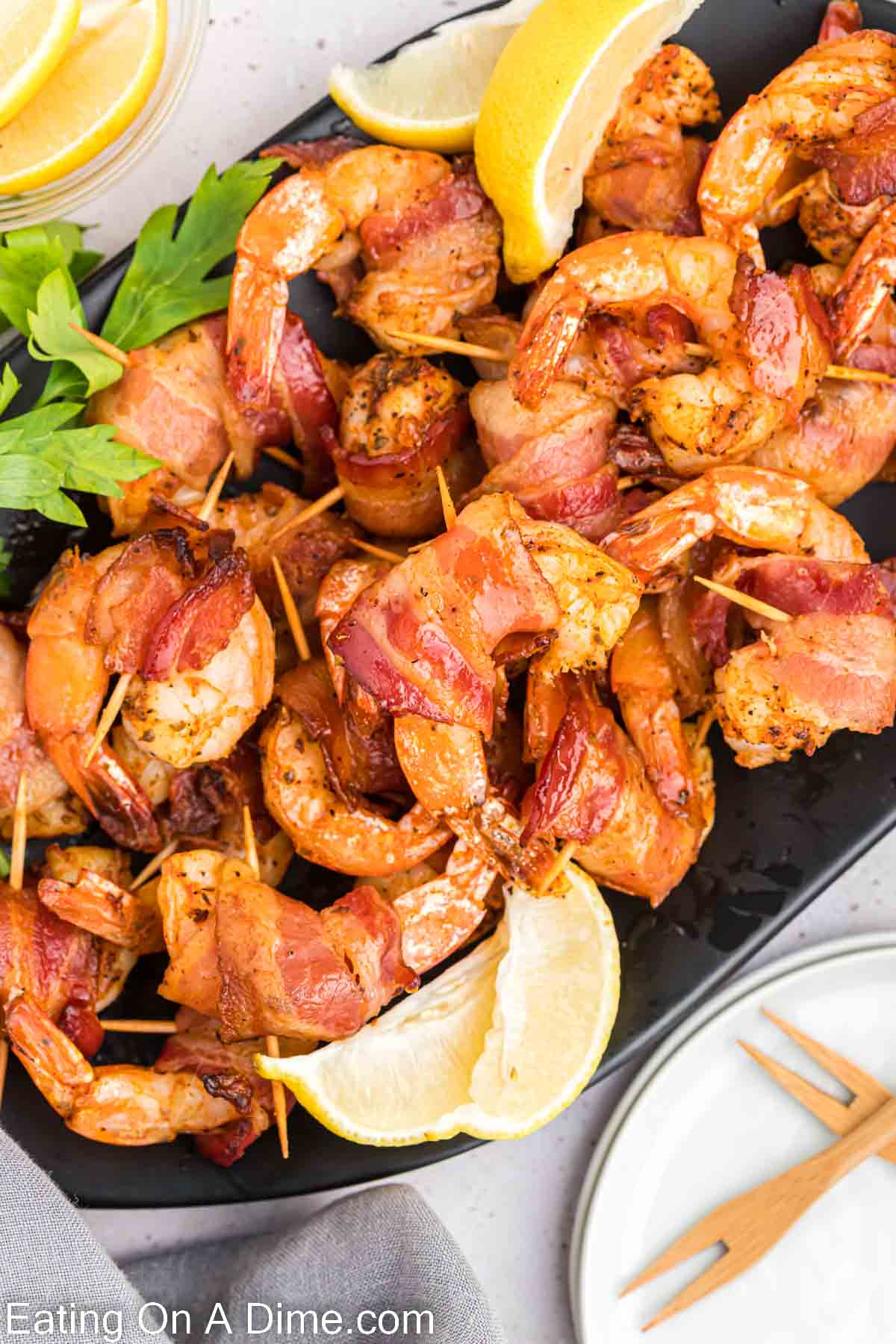 Bacon wrapped shrimp on a platter. 
