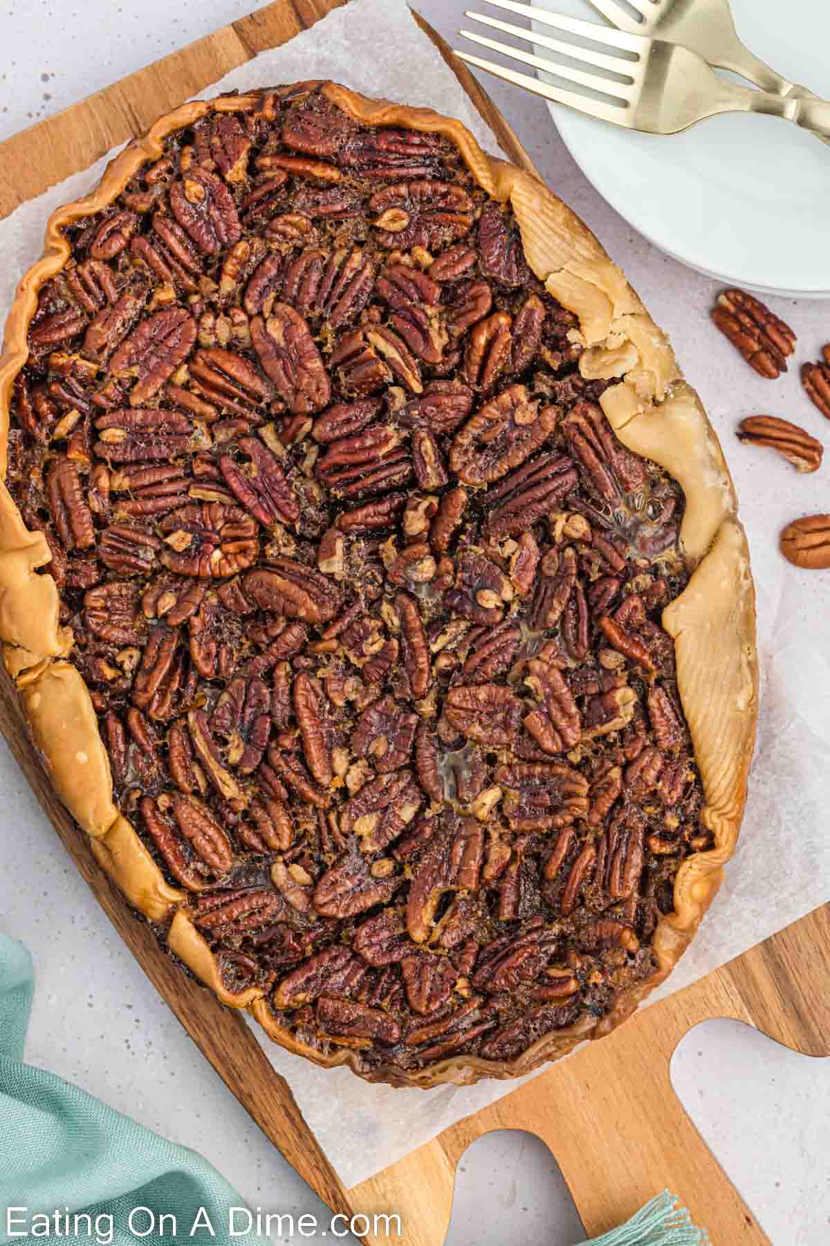 Cooked Pecan Pie on a cutting board