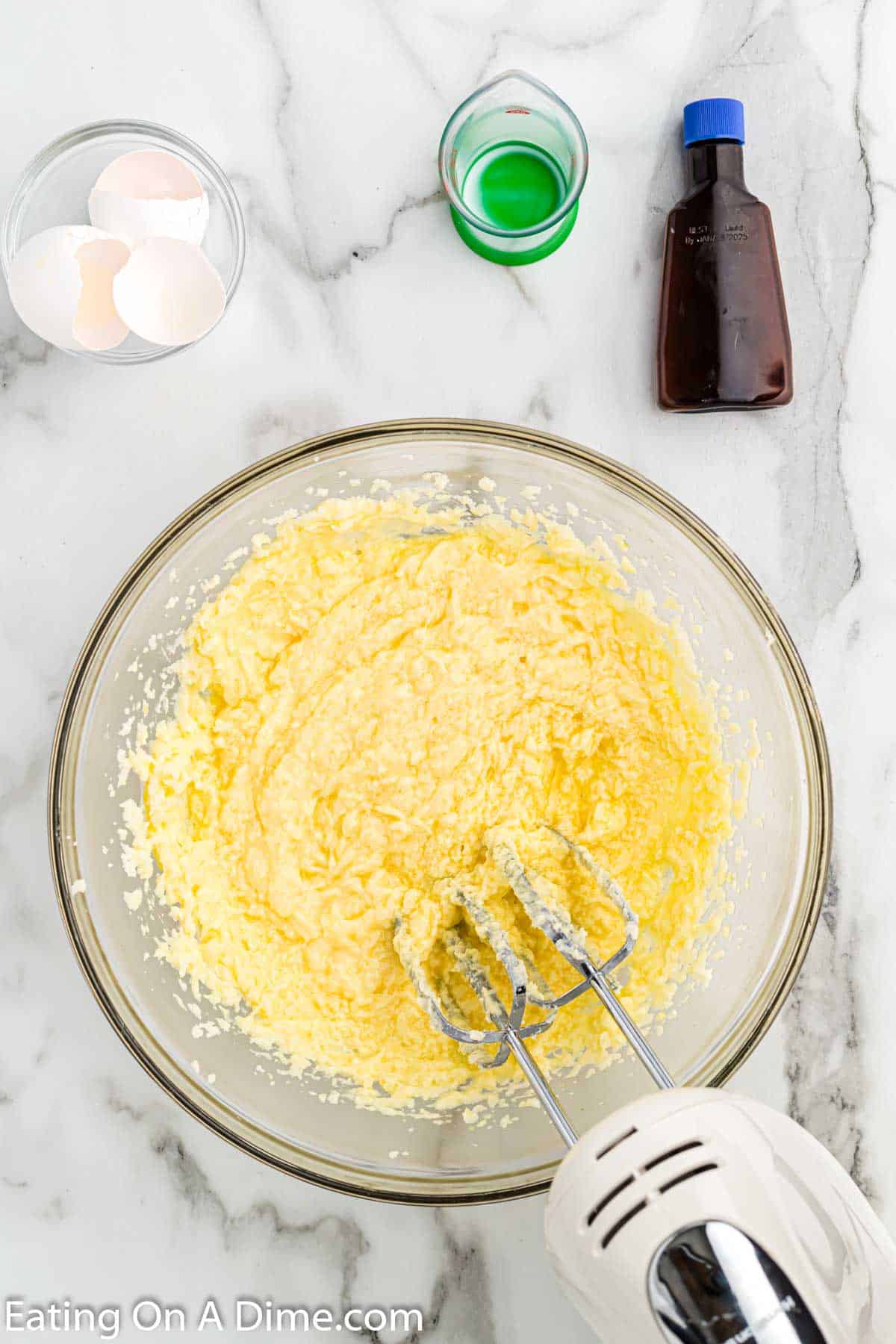 Beat together in butter and sugar in a bowl. Then mixing in eggs, milk and vanilla