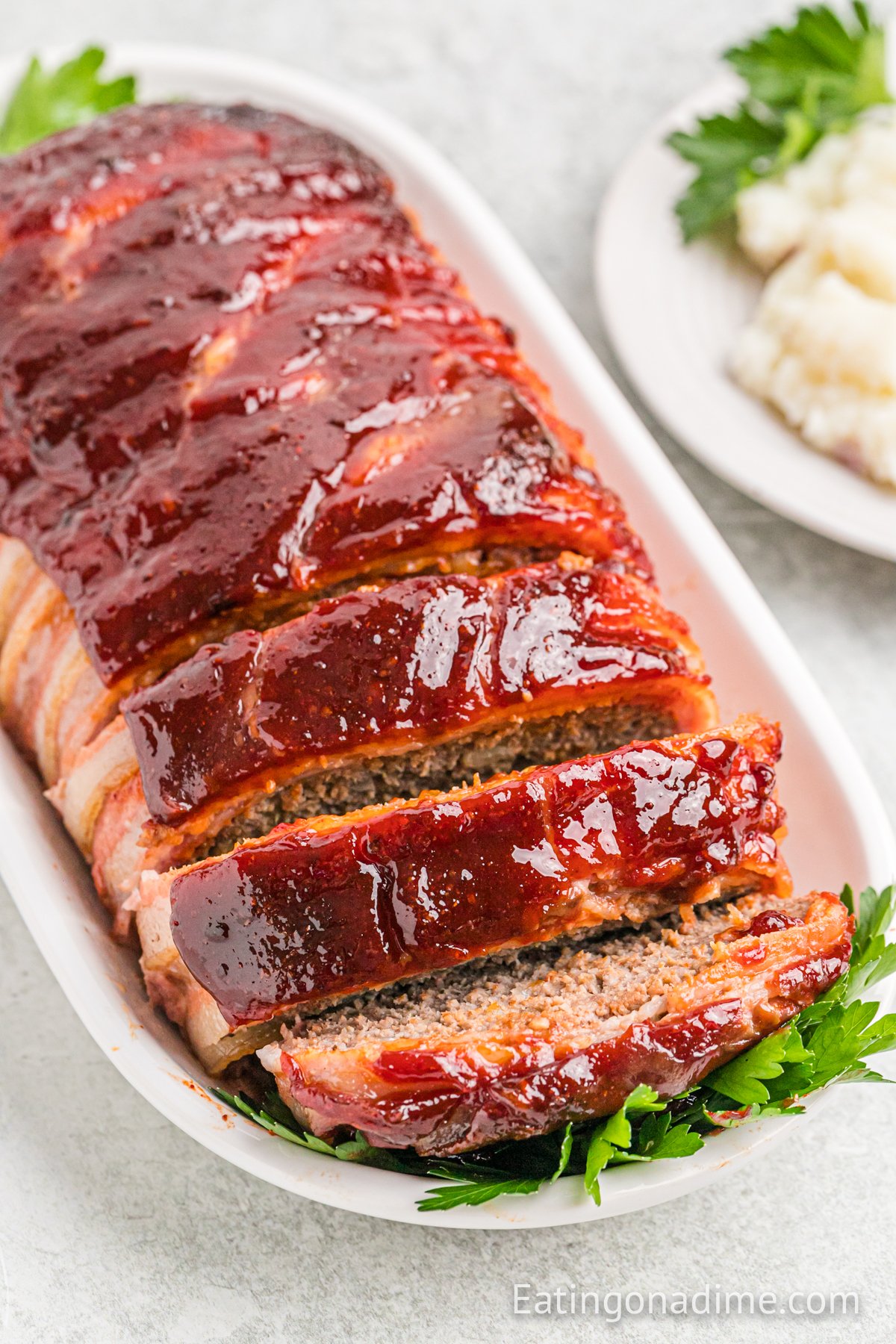 Bacon Wrapped Meatloaf on a platter