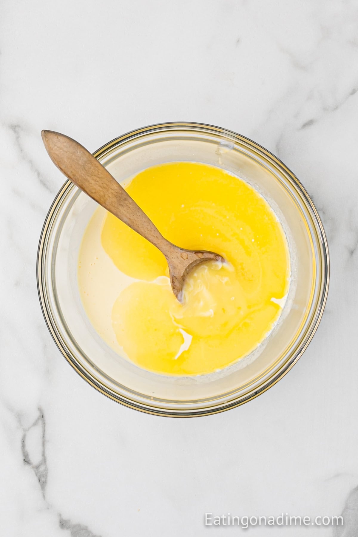 Melted butter to the milk mixture in a bowl.