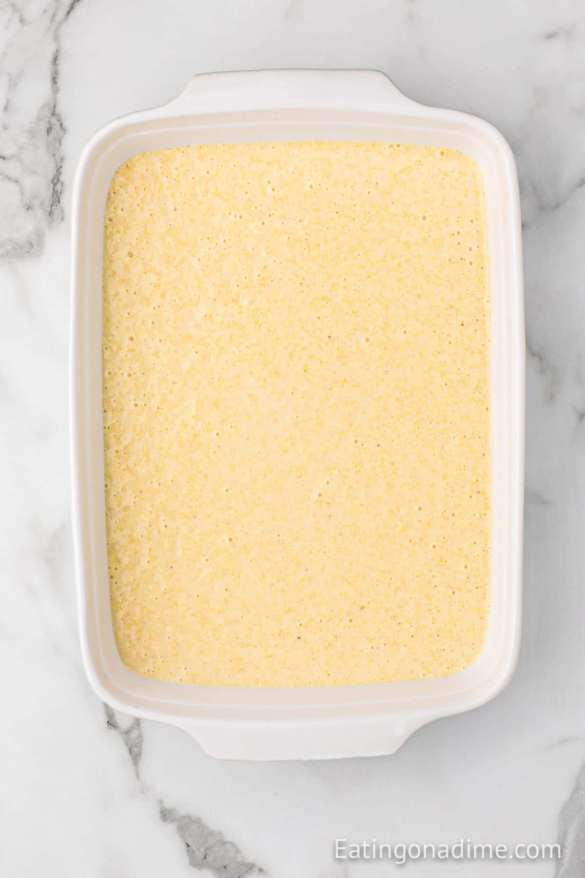 Cornbread batter added to the baking dish.