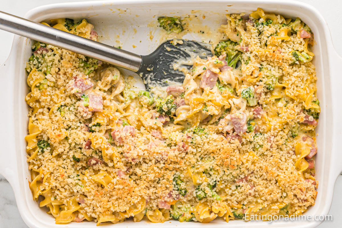 leftover ham casserole in a baking dish with spatula
