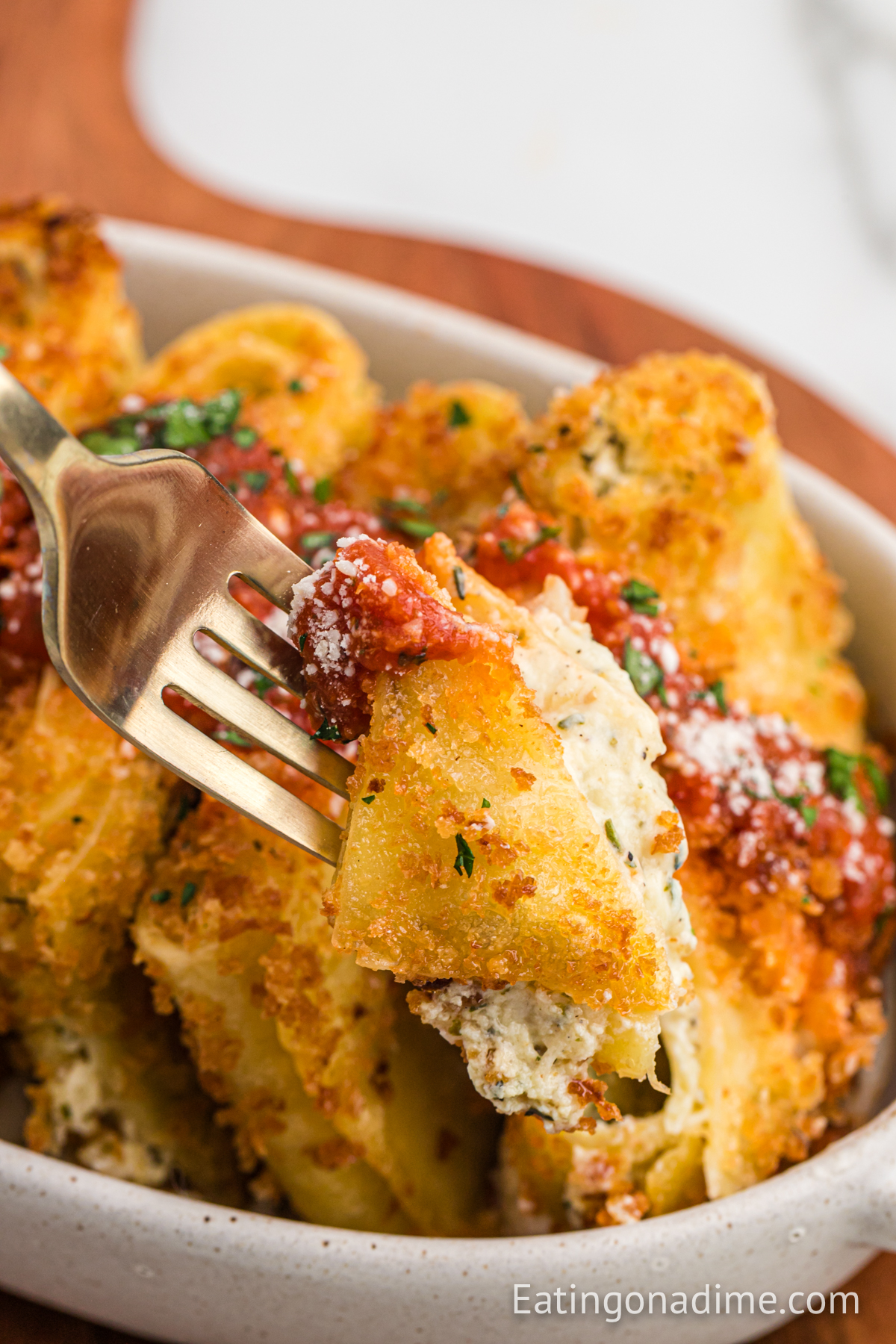 Fried Lasagna in a dish with a bite on a fork
