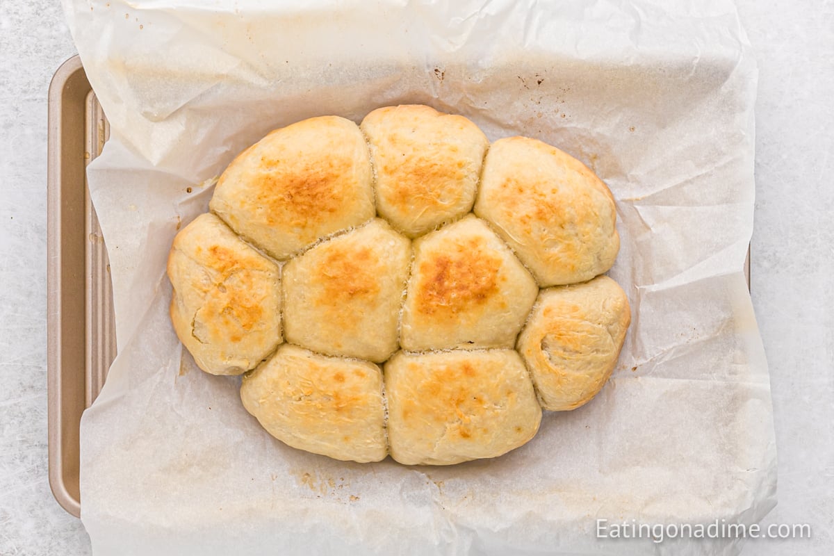 Slow Cooker Dinner Rolls on a baking sheet lined with baking sheet
