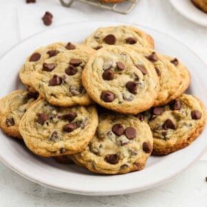 Chocolate Chip Pudding Cookies stacked on a plate.