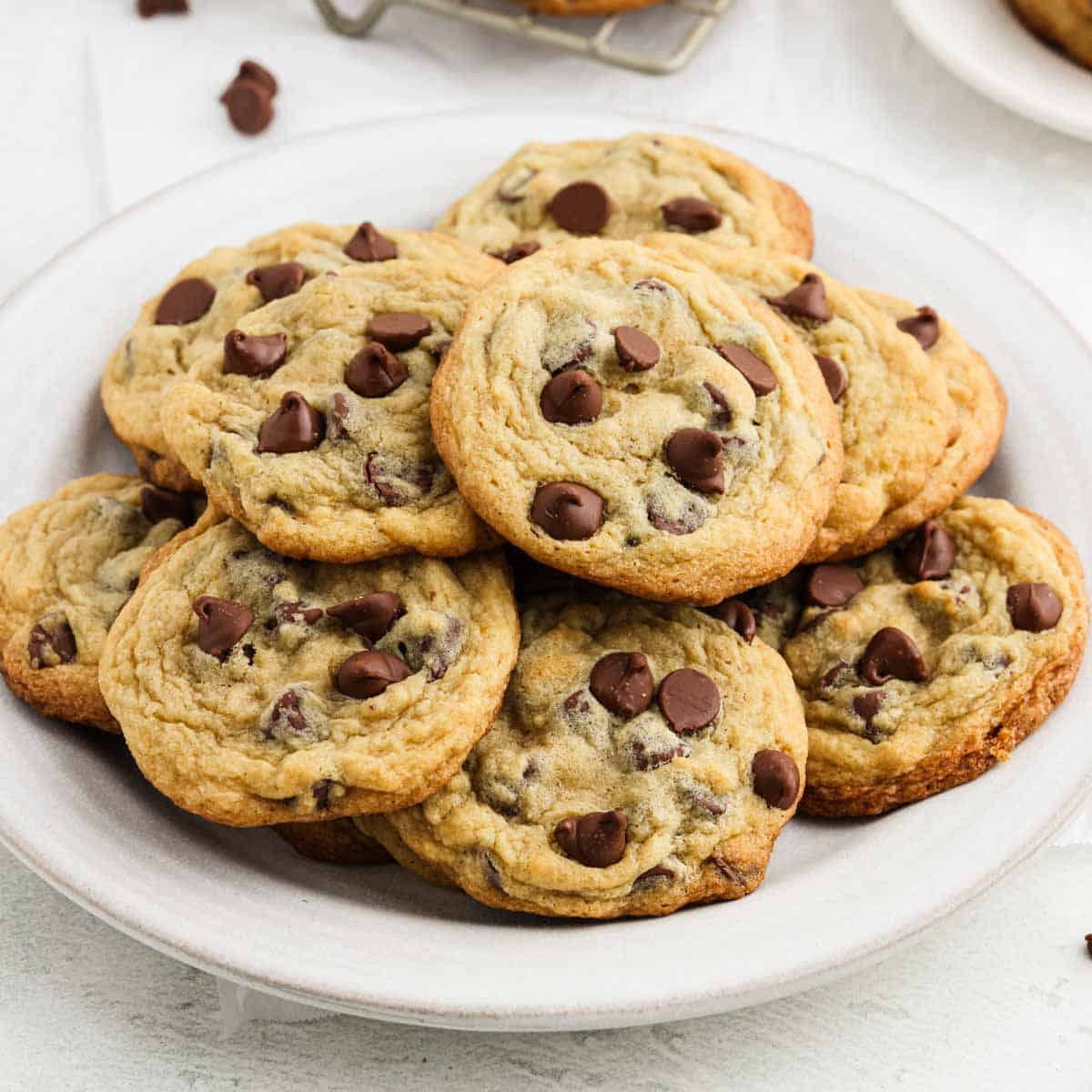Chocolate Chip Pudding Cookies stacked on a plate.
